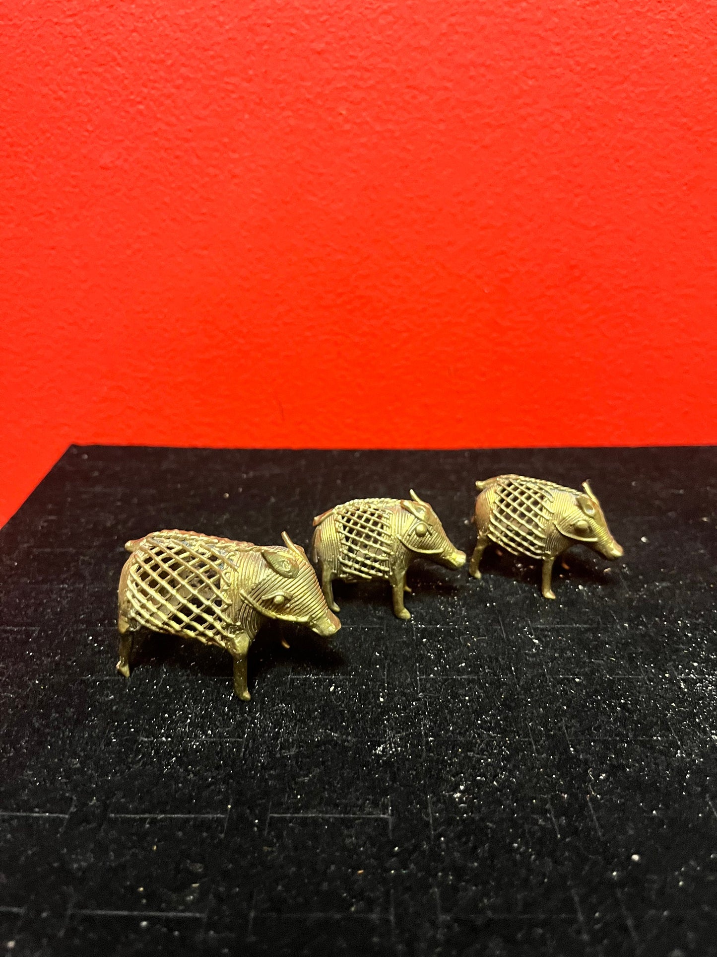 Lovely set of three African Benin brass boars older 1.5 to 2 inches long each