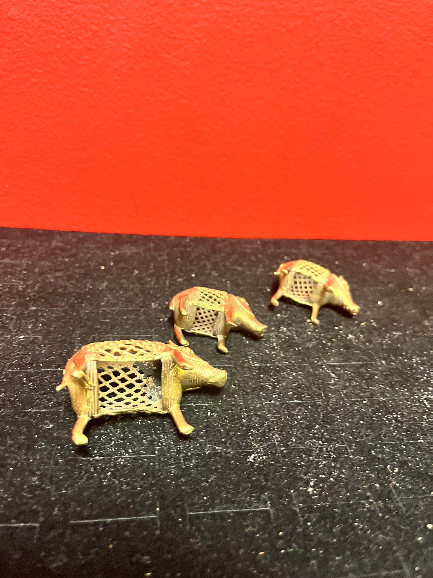 Lovely set of three African Benin brass boars older 1.5 to 2 inches long each