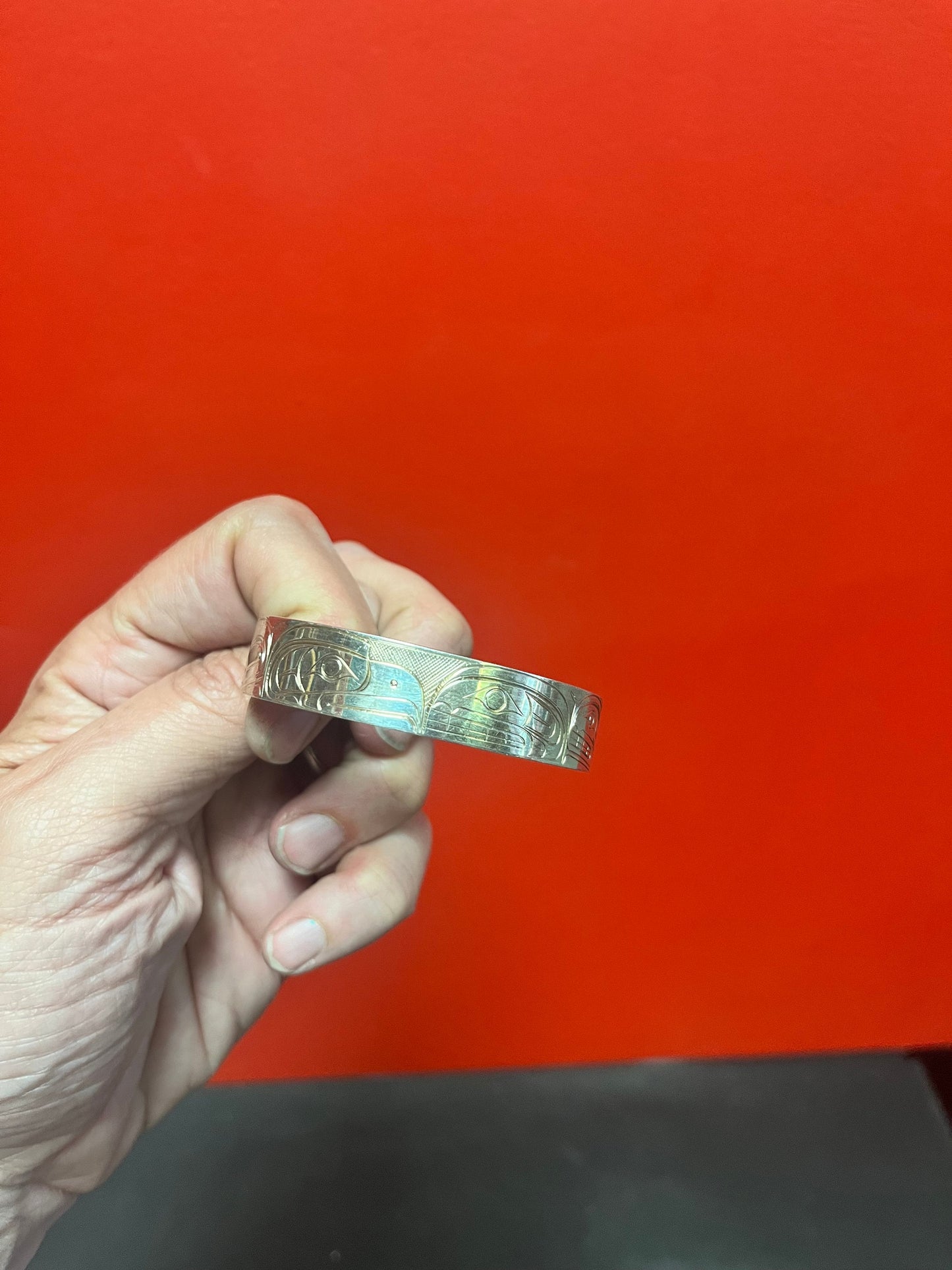 Lovely 2 1/2 inch wide heavy signed indigenous first nations Pacific Northwest Coast Sterling bracelet by famous Tony hunt wow