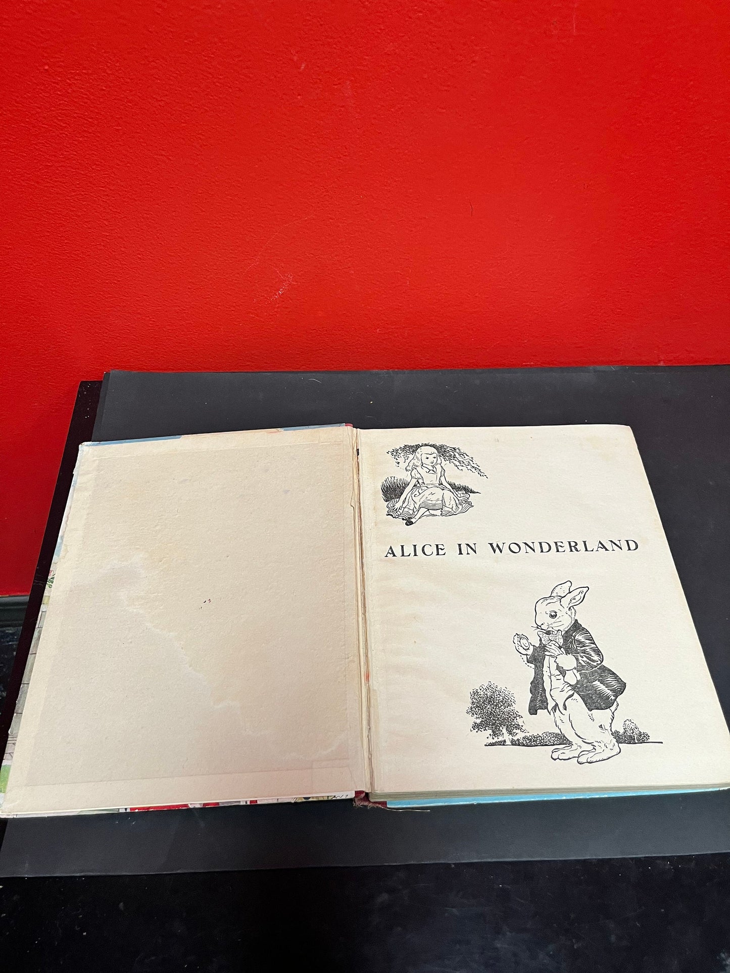 Antique 10 x 8 Alice in Wonderland book by Lewis Carroll as is see photos