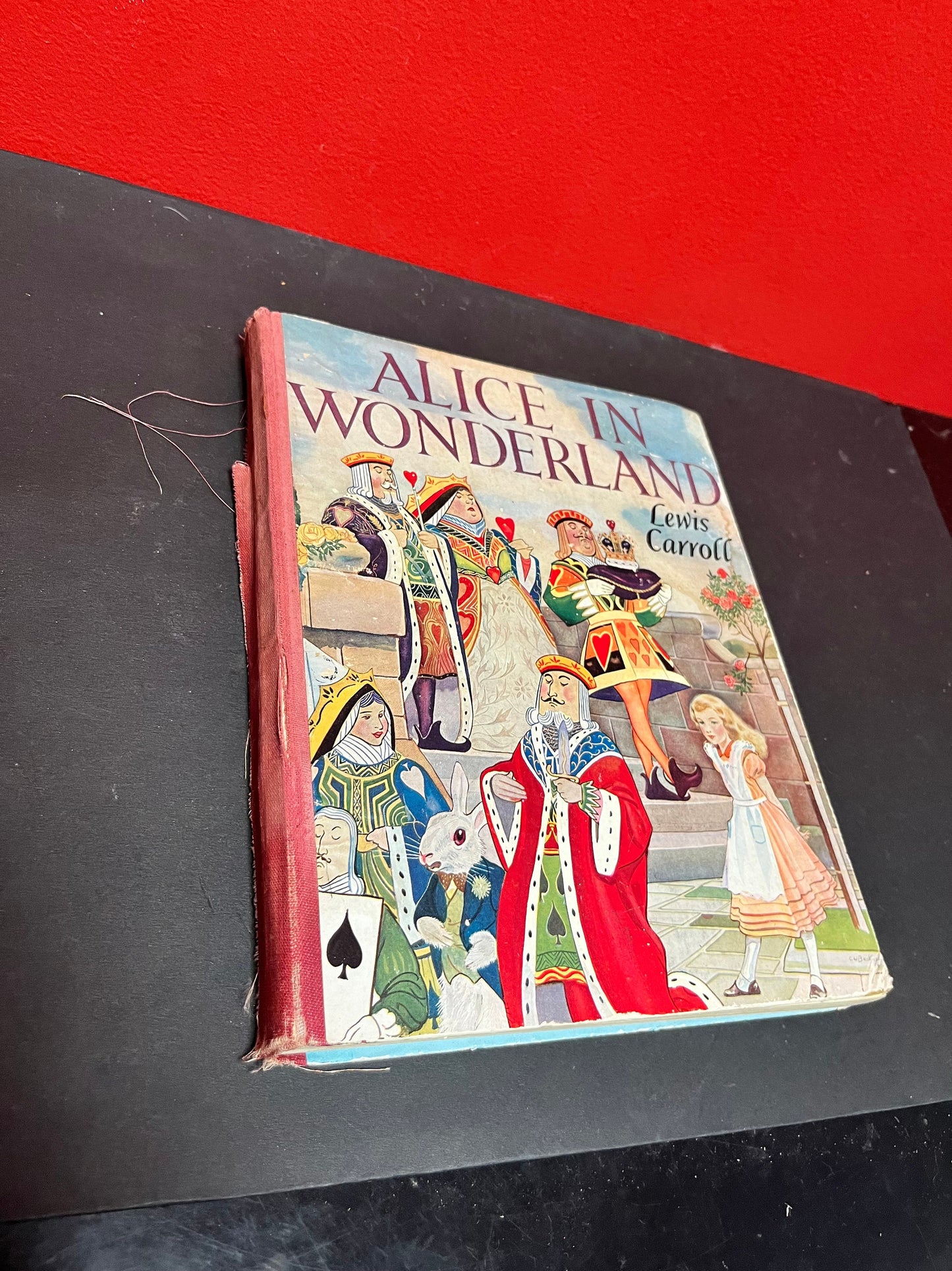 Antique 10 x 8 Alice in Wonderland book by Lewis Carroll as is see photos