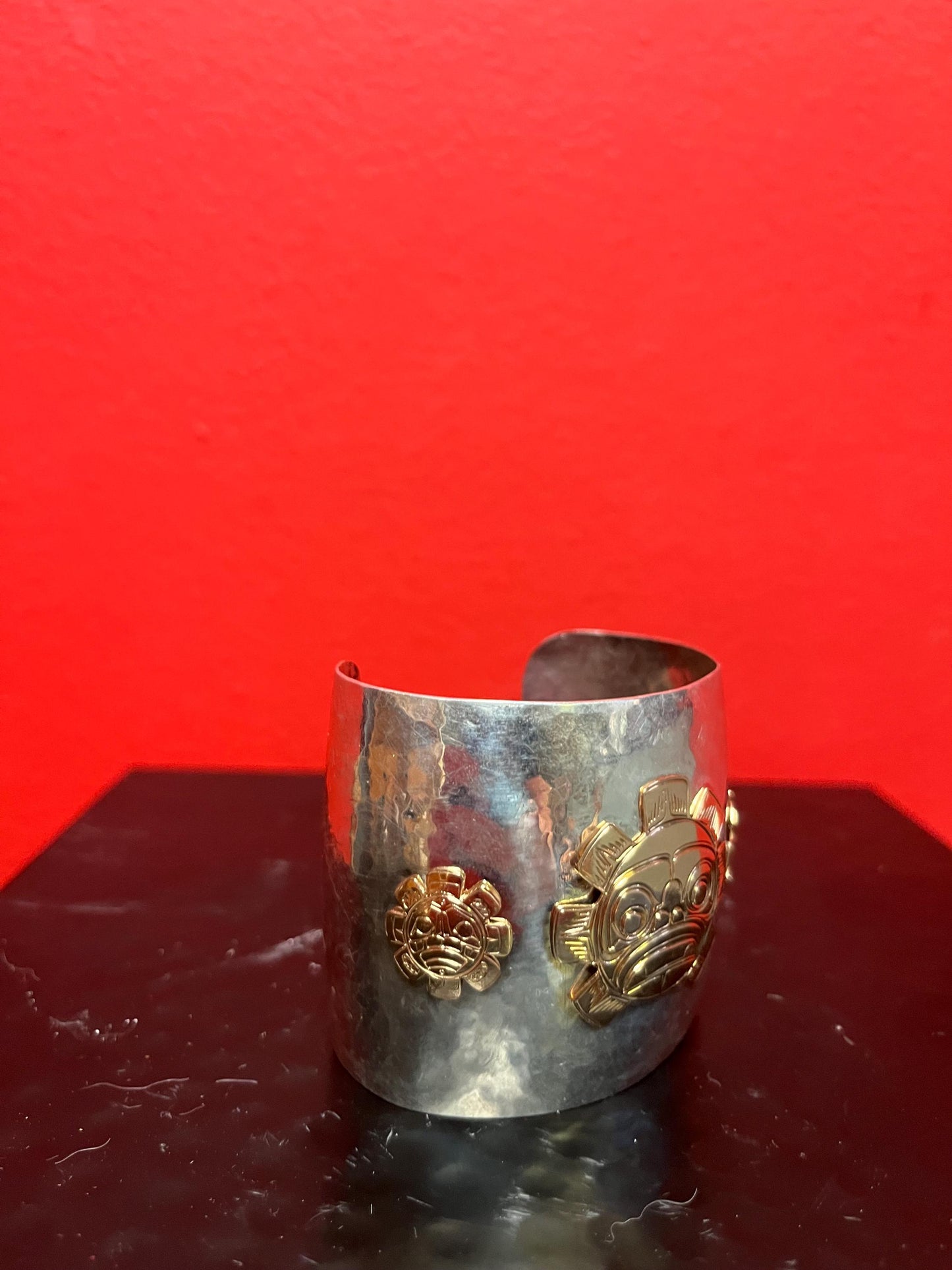 Magnificent signed heavy sterling and gold sun mask cuff indigenous First NationsNorthwest Coast 2 1/4 wide and 2 high, 7 circumference