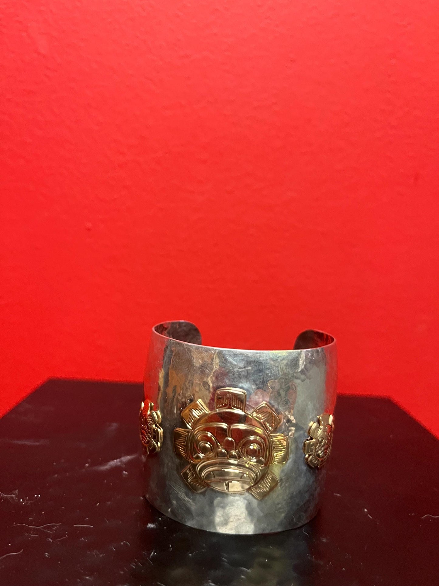 Magnificent signed heavy sterling and gold sun mask cuff indigenous First NationsNorthwest Coast 2 1/4 wide and 2 high, 7 circumference
