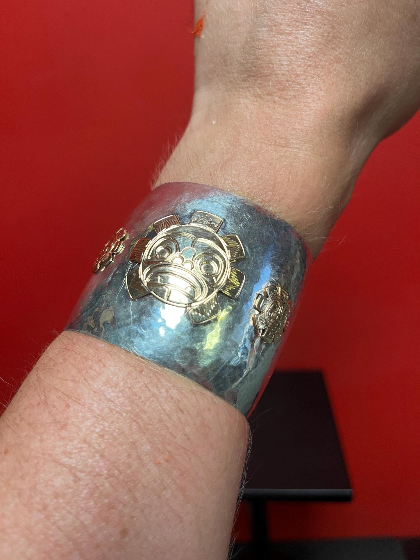 Magnificent signed heavy sterling and gold sun mask cuff indigenous First NationsNorthwest Coast 2 1/4 wide and 2 high, 7 circumference