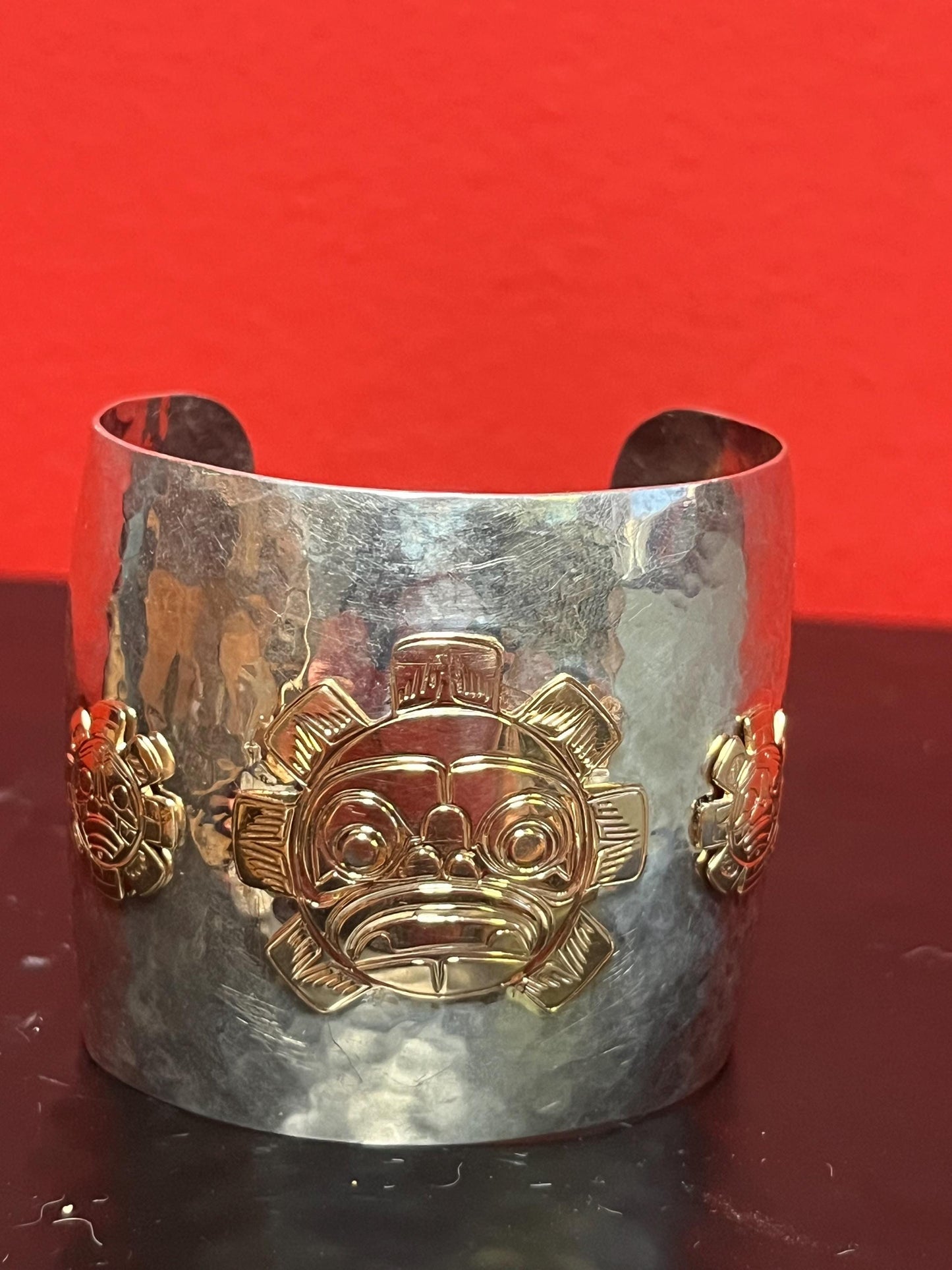 Magnificent signed heavy sterling and gold sun mask cuff indigenous First NationsNorthwest Coast 2 1/4 wide and 2 high, 7 circumference