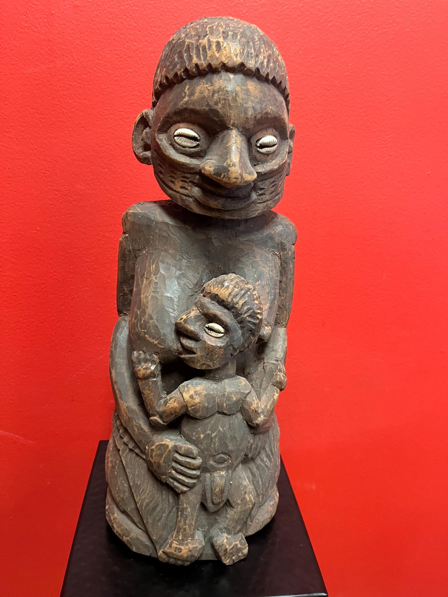 Super West African 16 inch wood statue of a mother feeding her son shell eyes amazing patina and imagery antique heavy African beauty