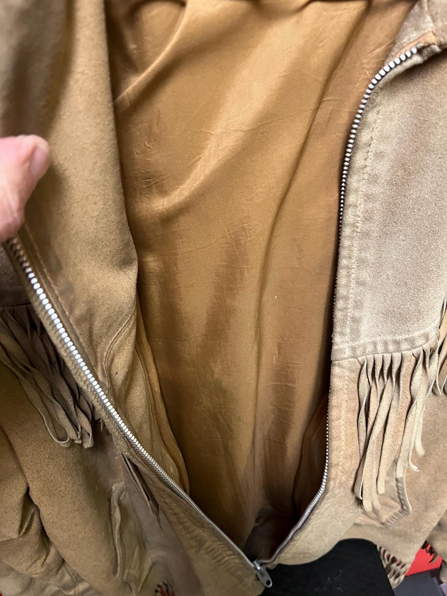 Vintage 33 inch long by 14 inch chest cowhide Cherokee style jacket with tassels very cool and ready to wear