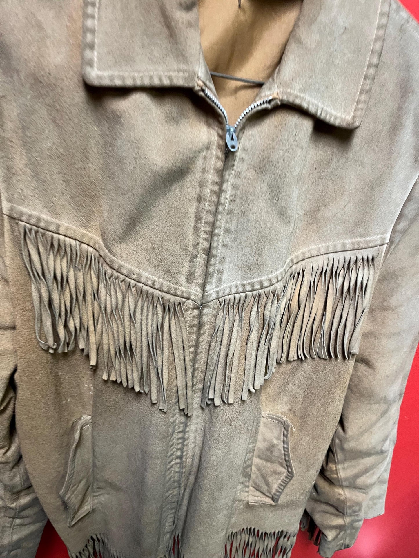Vintage 33 inch long by 14 inch chest cowhide Cherokee style jacket with tassels very cool and ready to wear