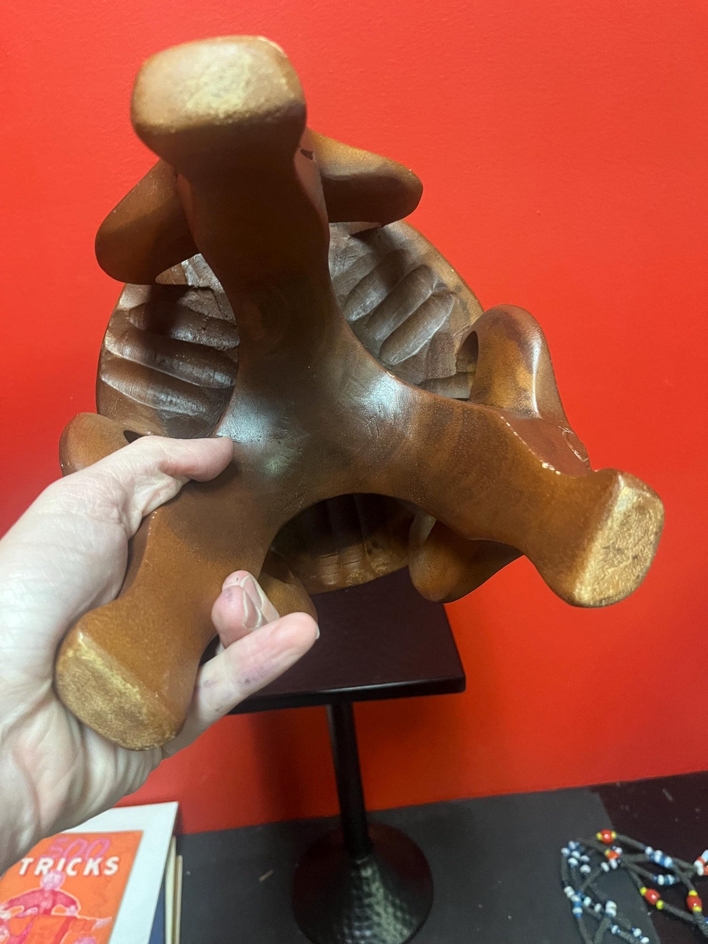 Very cool African 8 x 8 stool with legs the shape of yaks great conversation piece and great value