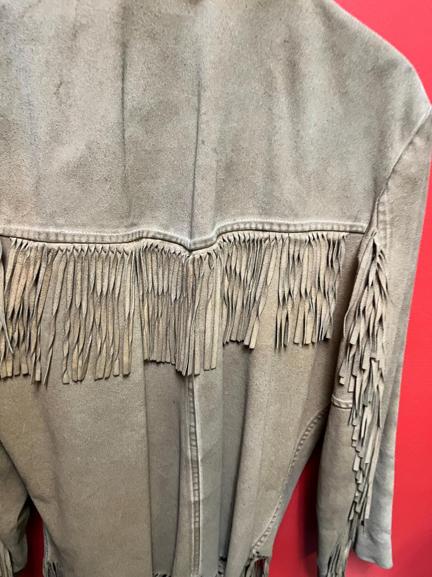 Vintage 33 inch long by 14 inch chest cowhide Cherokee style jacket with tassels very cool and ready to wear