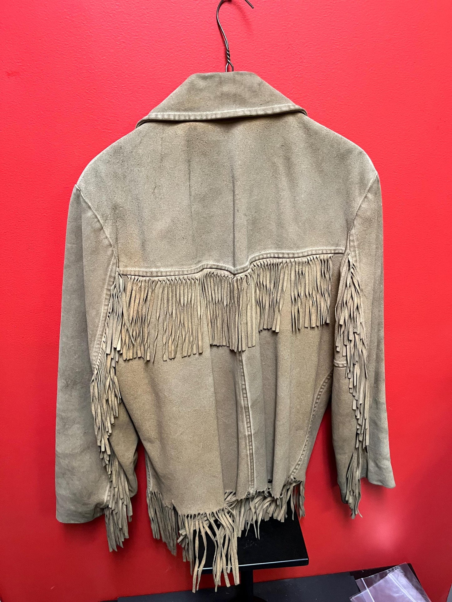Vintage 33 inch long by 14 inch chest cowhide Cherokee style jacket with tassels very cool and ready to wear