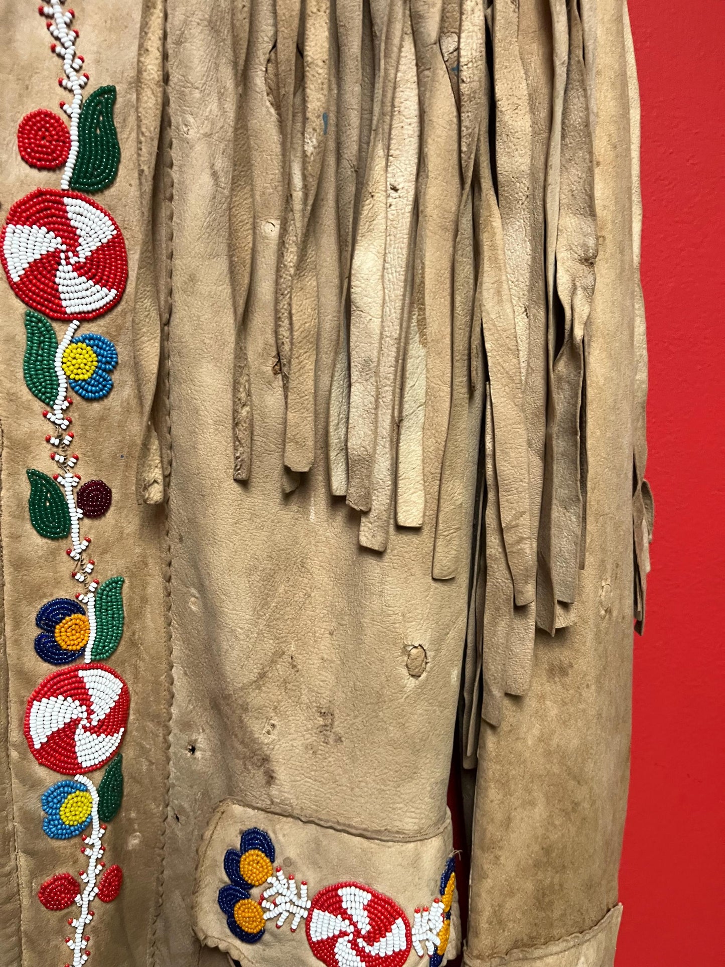 Stunning, indigenous native antique beaded jacket approximately 32 inches long and 16 inch chest medium to large minor damage see photo