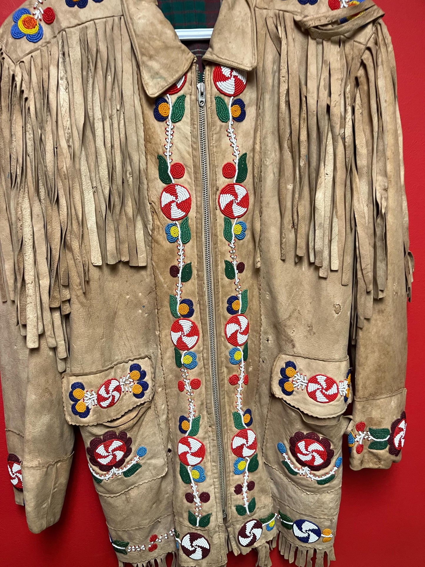 Stunning, indigenous native antique beaded jacket approximately 32 inches long and 16 inch chest medium to large minor damage see photo