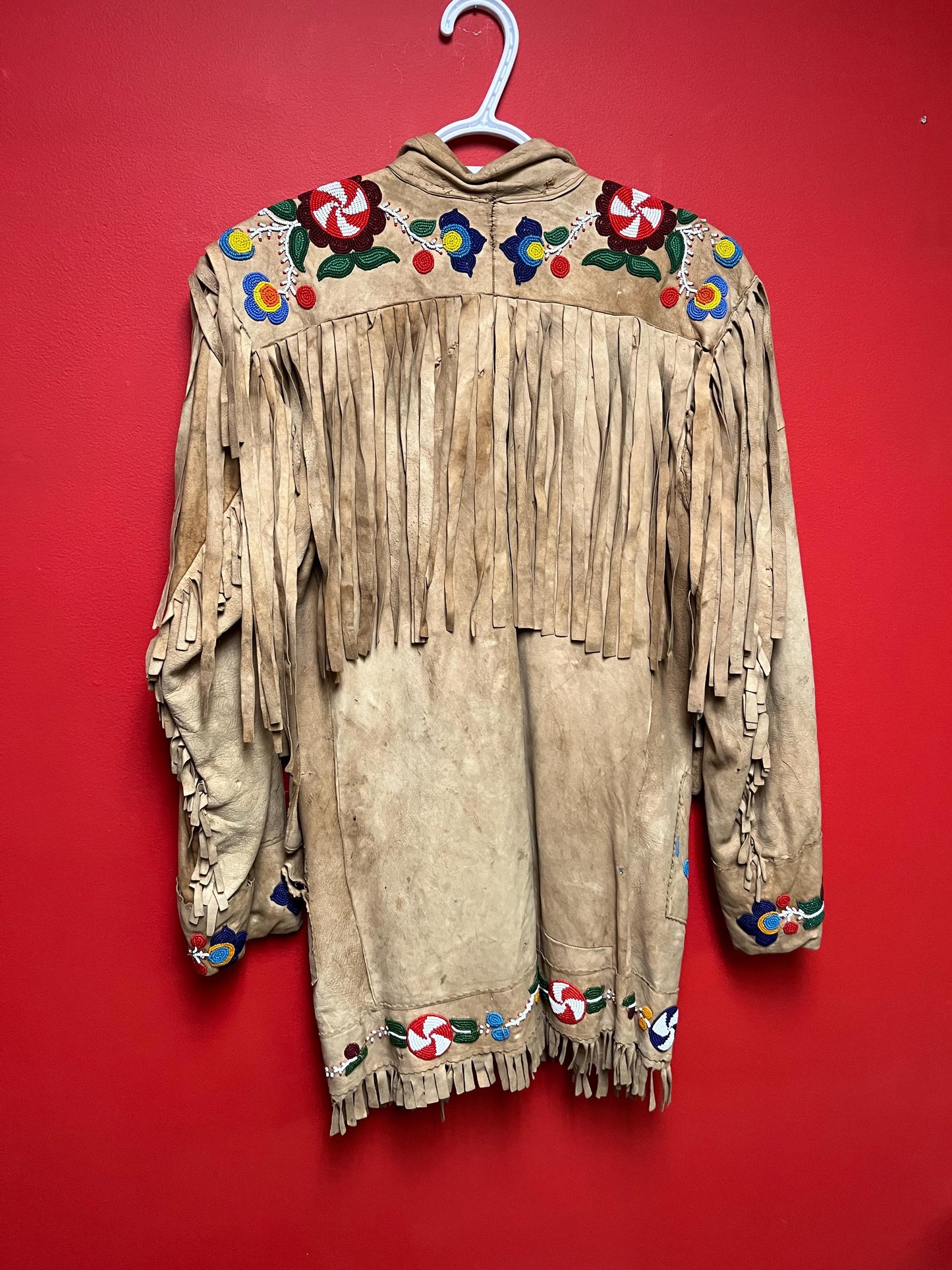 Stunning, indigenous native antique beaded jacket approximately 32 inches long and 16 inch chest medium to large minor damage see photo