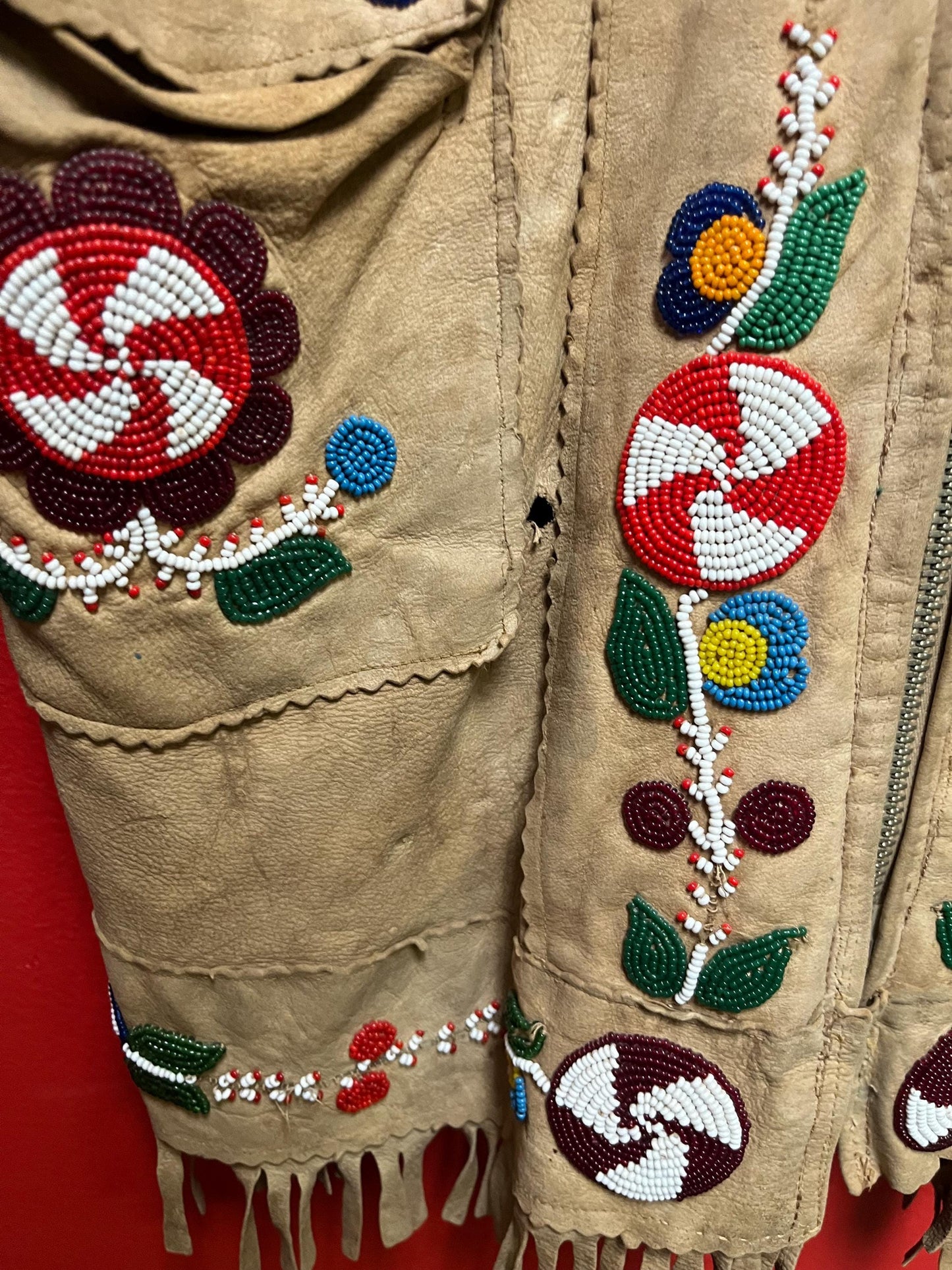 Stunning, indigenous native antique beaded jacket approximately 32 inches long and 16 inch chest medium to large minor damage see photo