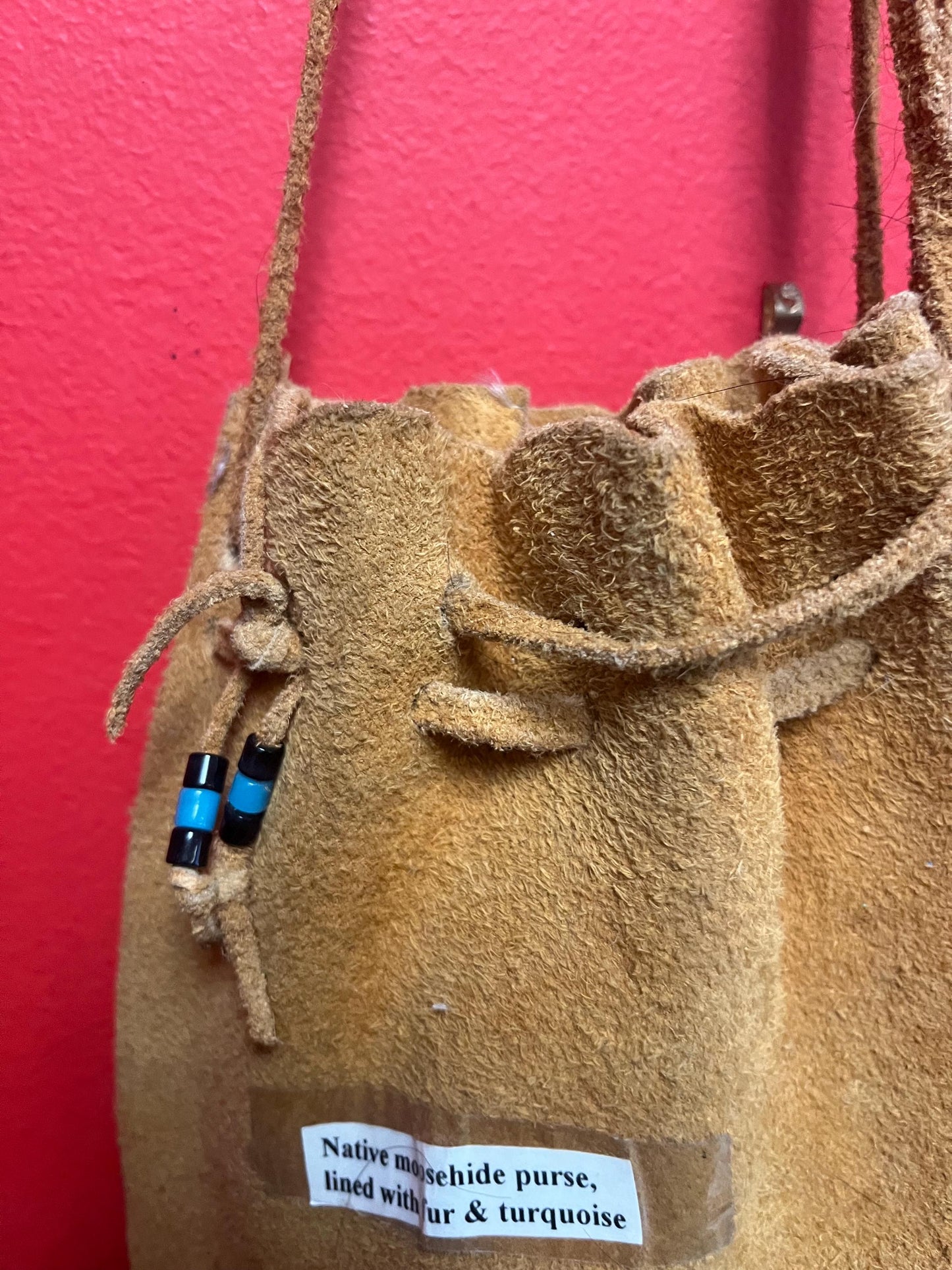 stunning American native moosehide purse lined with fur and turquoise pretty good condition see photos- 34 inches total and bag 10 inches
