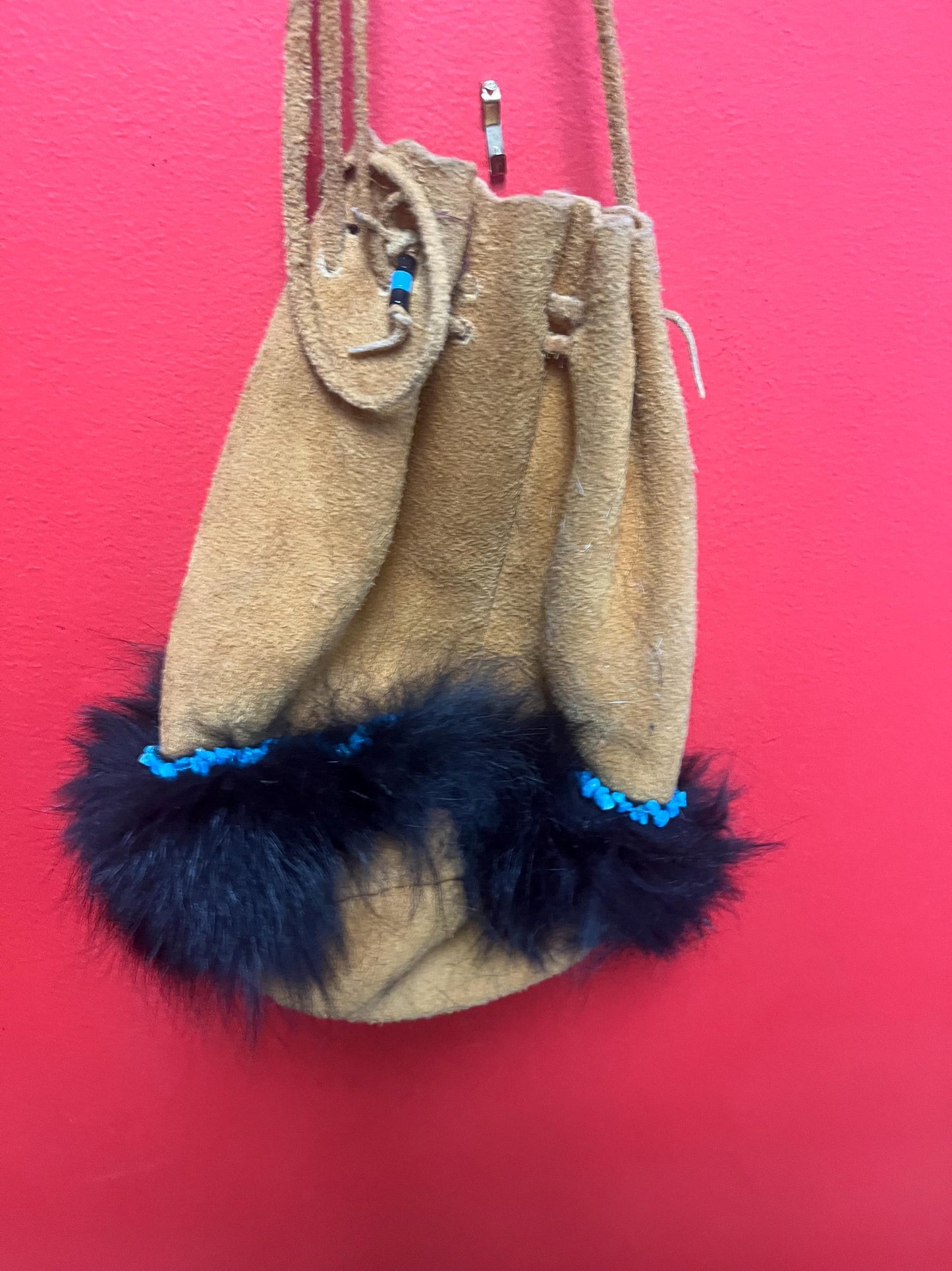 stunning American native moosehide purse lined with fur and turquoise pretty good condition see photos- 34 inches total and bag 10 inches