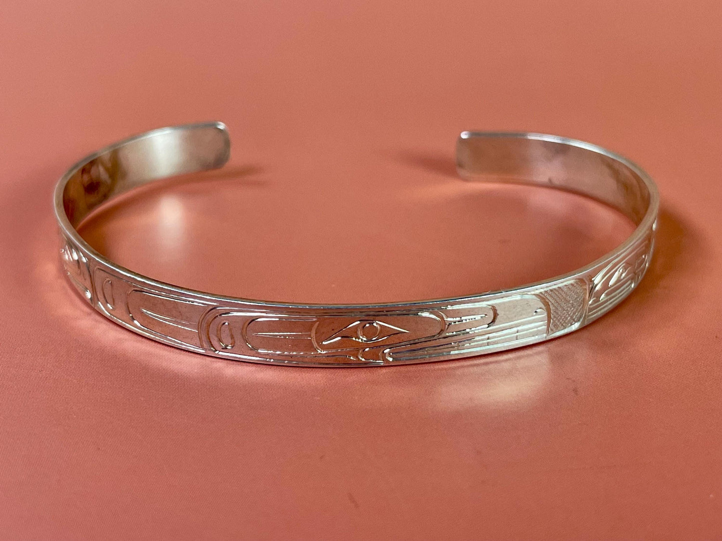 Stunning 2 1/2 inch wide indigenous first nations northwest coast Sterling Tony Hunt eagle and salmon bracelet amazing detail