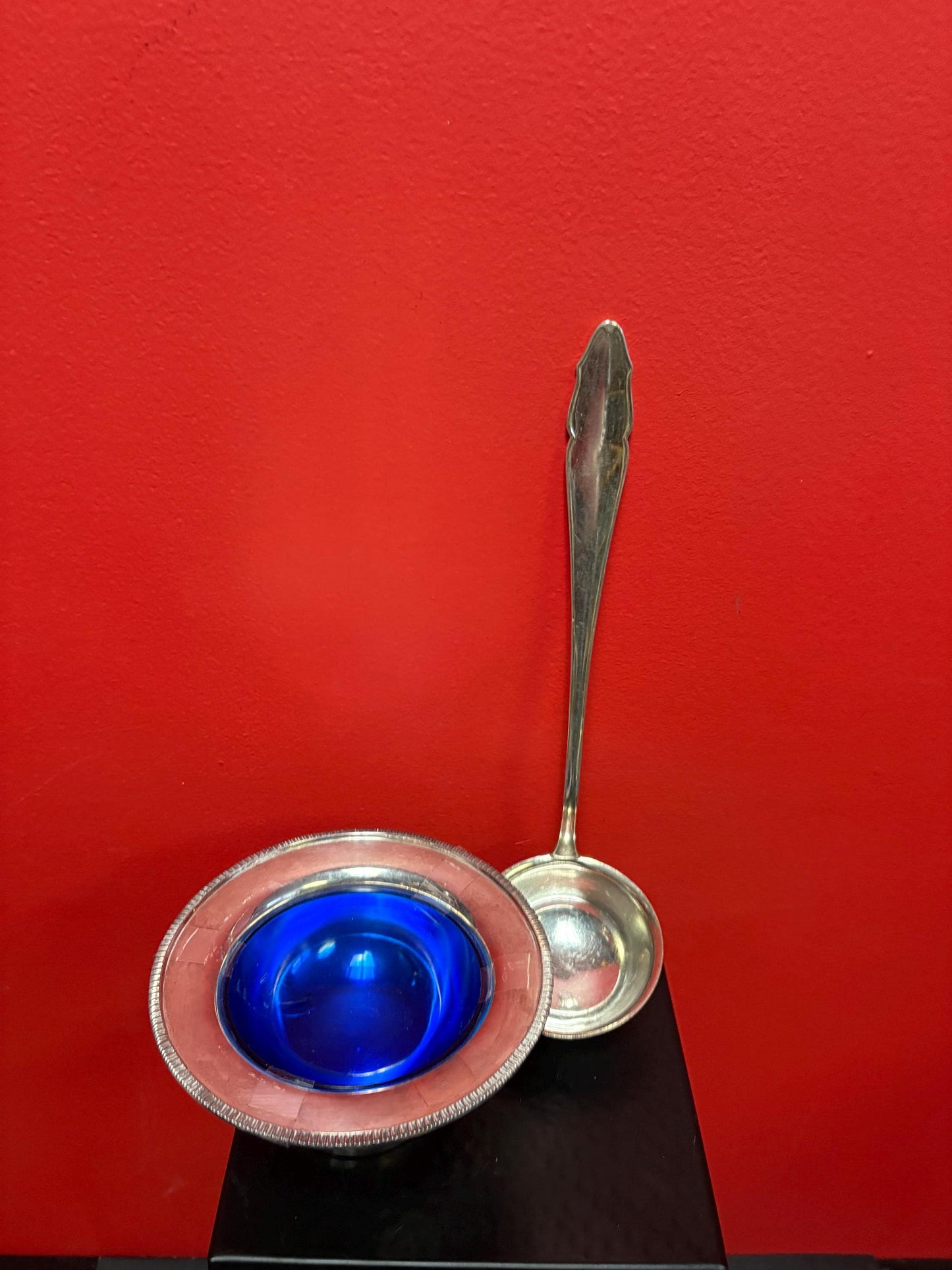 Antique silver plated ladle and bowl with cobalt blue liner ladle 12 inches long and bowl 6 inches across great deal for both