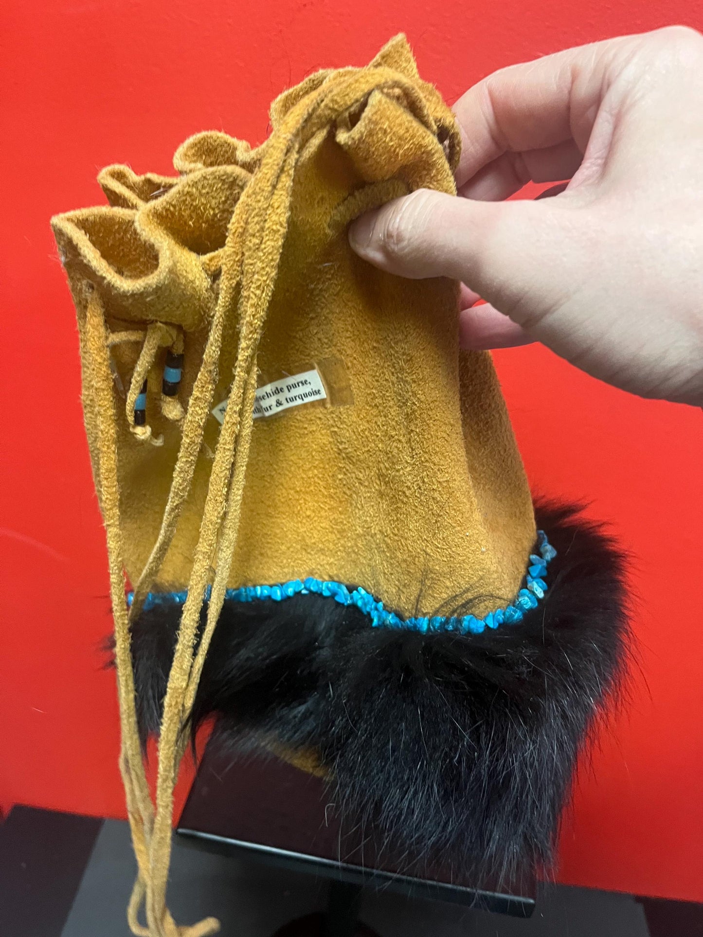 stunning American native moosehide purse lined with fur and turquoise pretty good condition see photos- 34 inches total and bag 10 inches