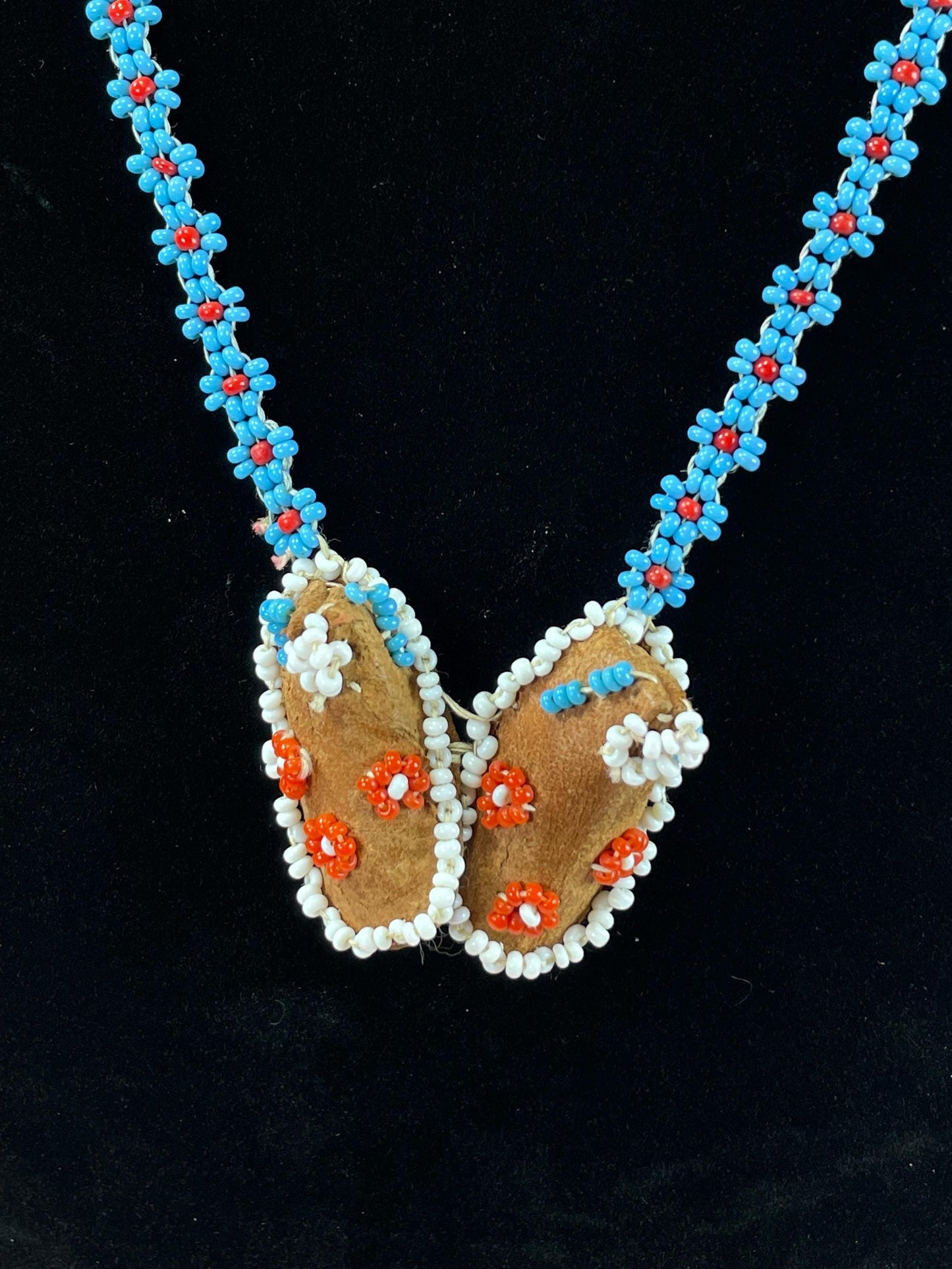 Beautiful approximately 22 inch long, indigenous first nations pacific northwest coast beaded necklace with tiny moccasins  great condition