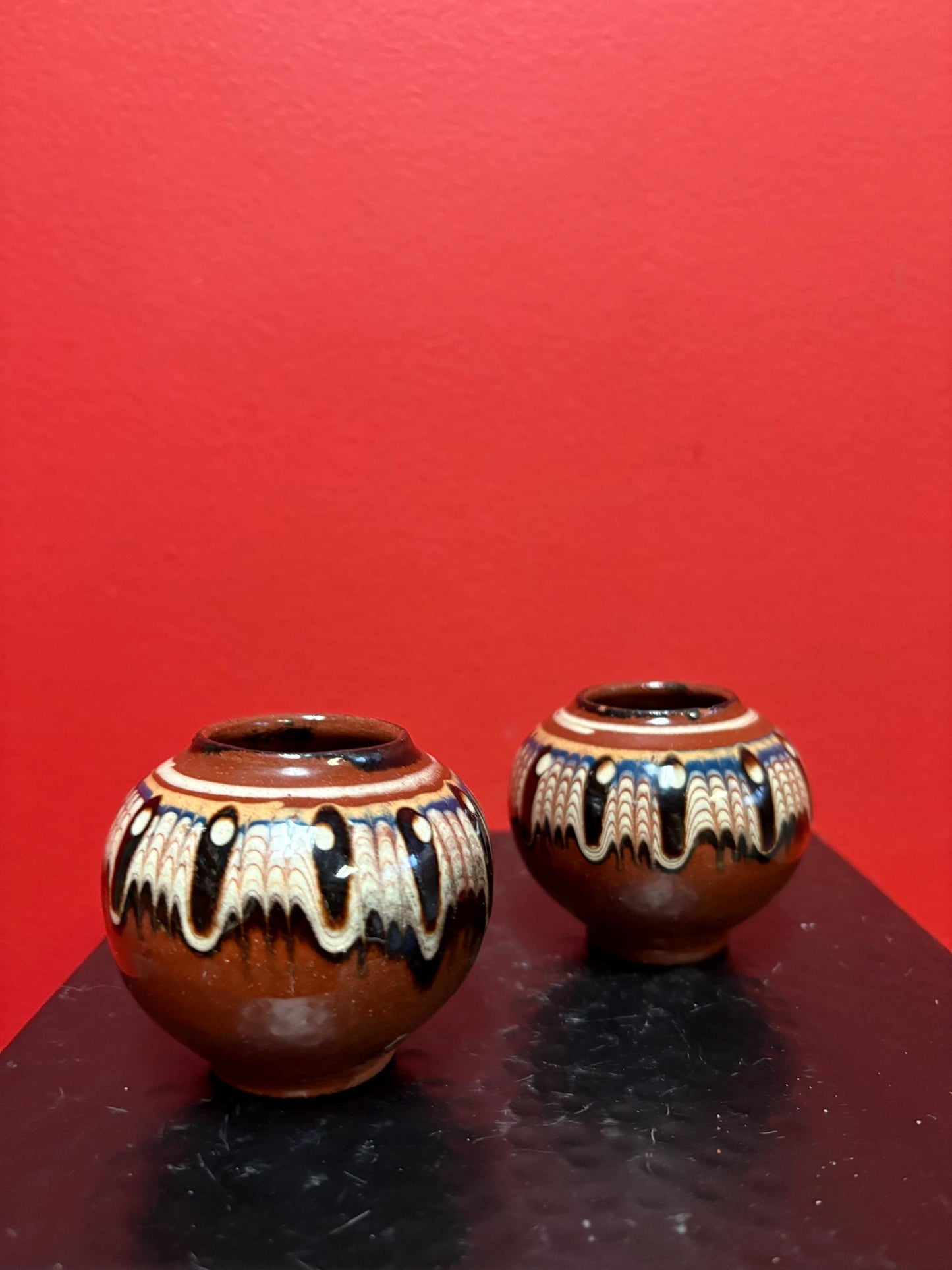 Lovely pair of 2 1/2 inch high South American terra-cotta painted pots  one chipped and one perfect  great value