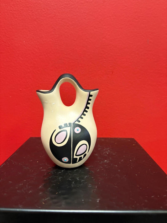 Lovely 4 1/2 inch tall signed Navajo pottery vase  great colour and shape