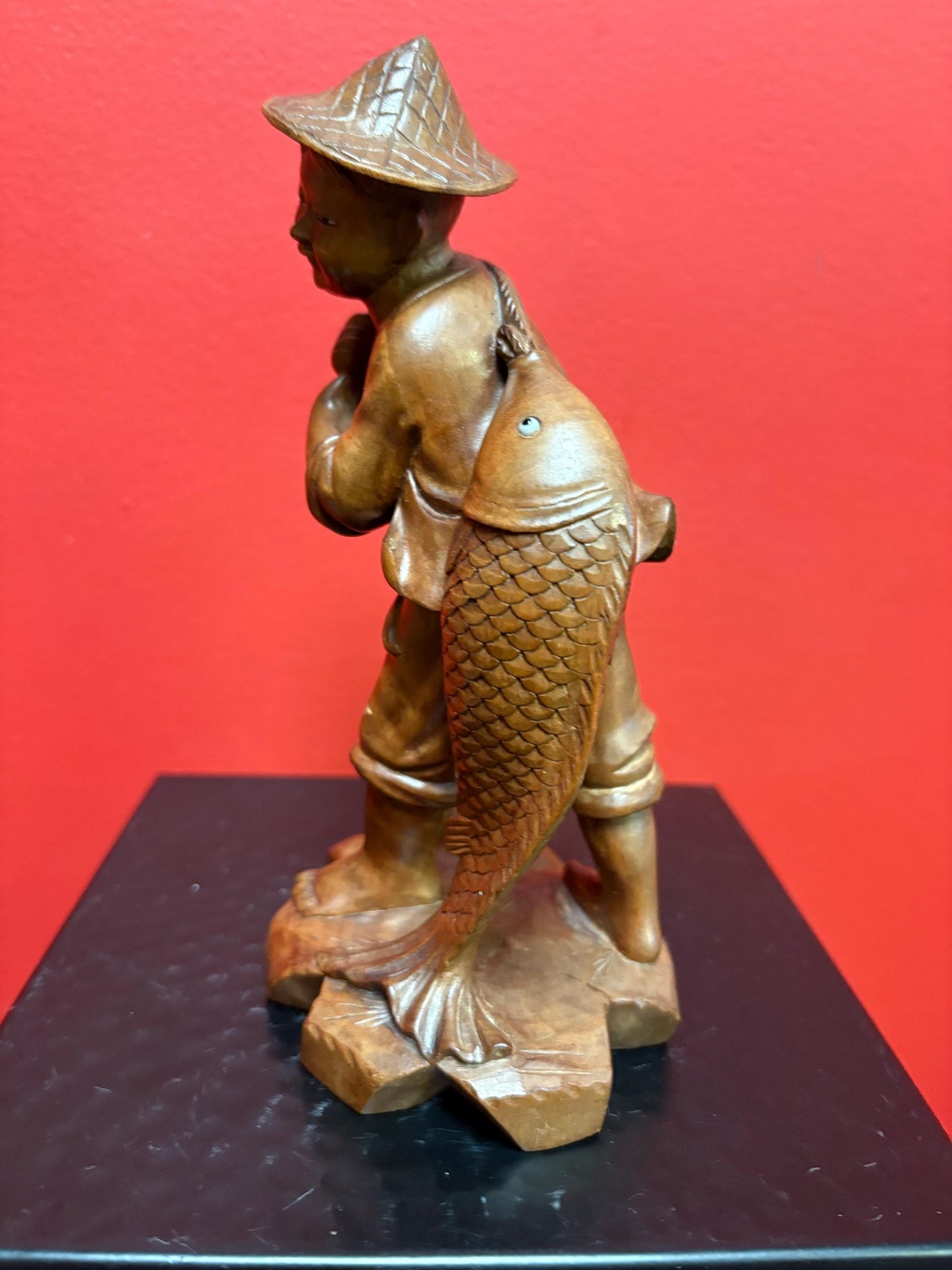 Stunning antique Asian carved wooden 7 1/2 inch tall statue of a fisherman intense detail and beautiful eyes wow