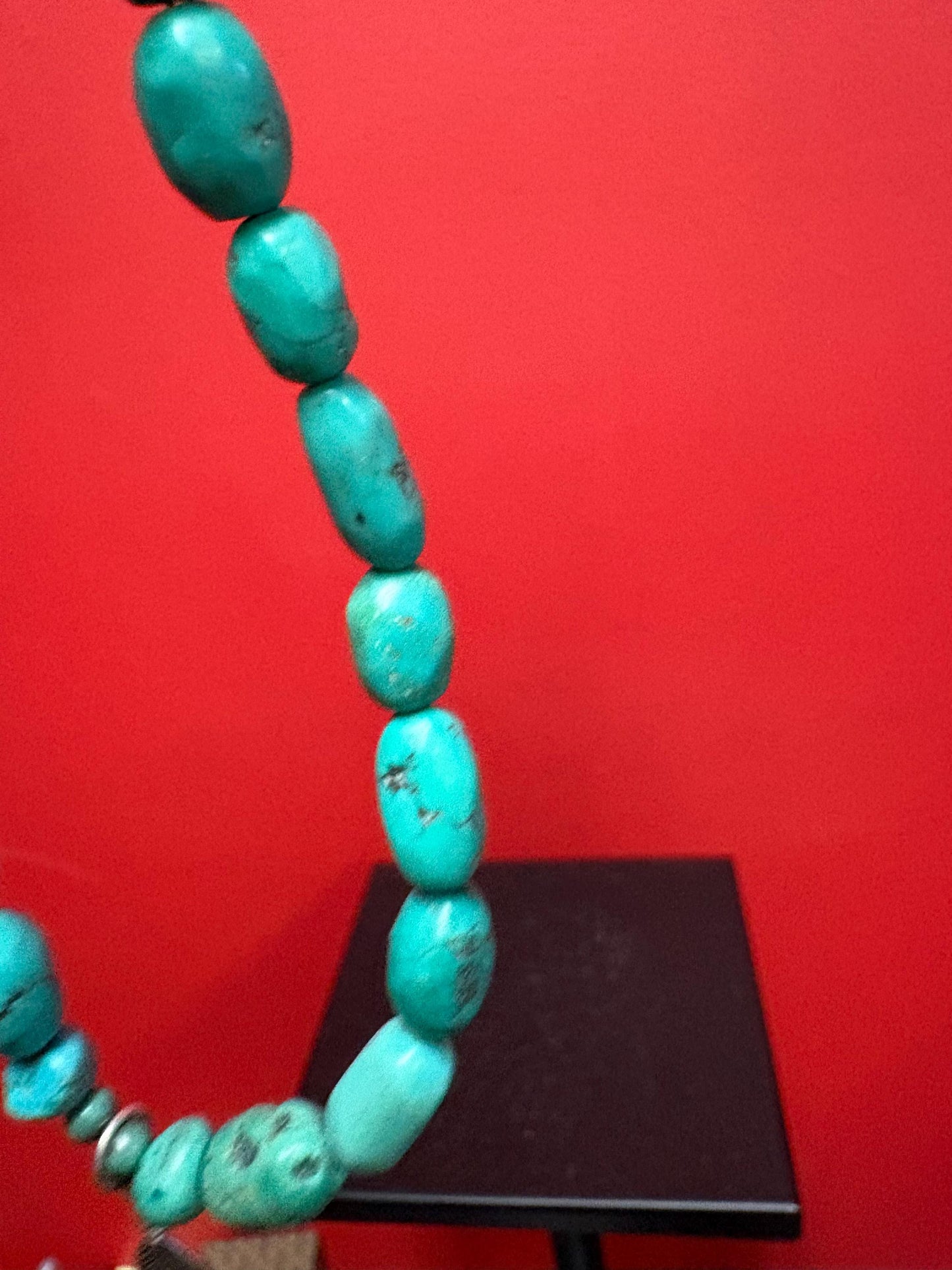 Beautiful approximately 14 inch long turquoise necklace with silver feather charm