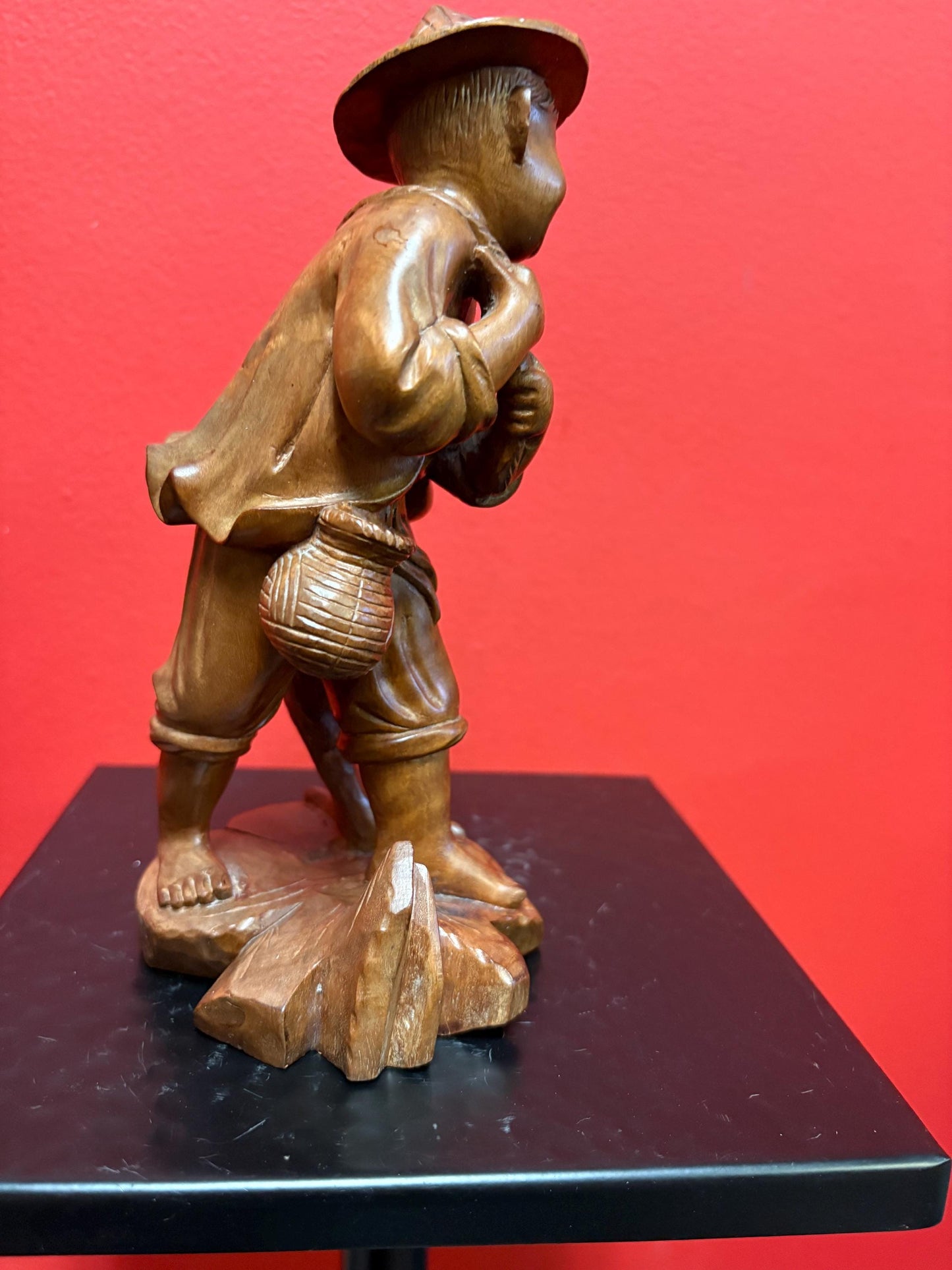 Stunning antique Asian carved wooden 7 1/2 inch tall statue of a fisherman intense detail and beautiful eyes wow