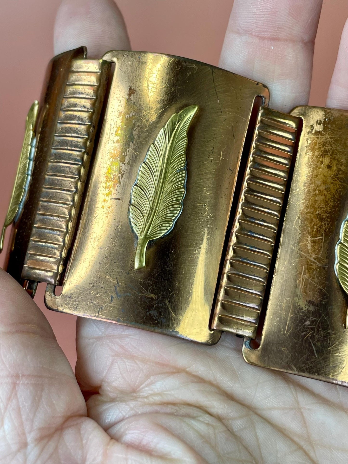 Wide Metal Link Bracelet with Feather Imagery so cool