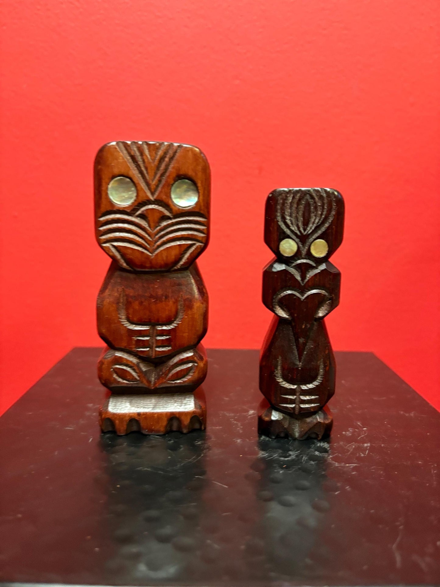 Two beautiful New Zealand Maori statues with abalone inset 4.5 and 4 inches tall sold as pair Maori