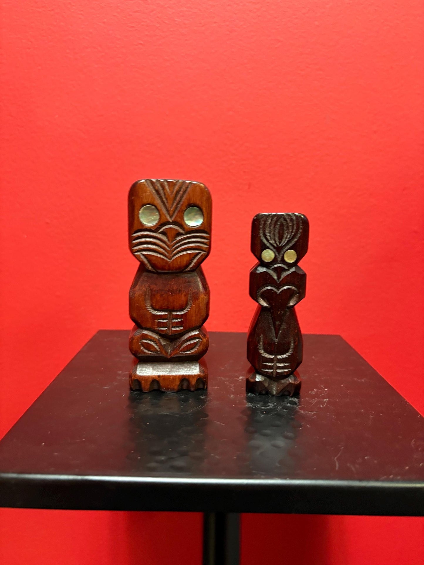 Two beautiful New Zealand Maori statues with abalone inset 4.5 and 4 inches tall sold as pair Maori