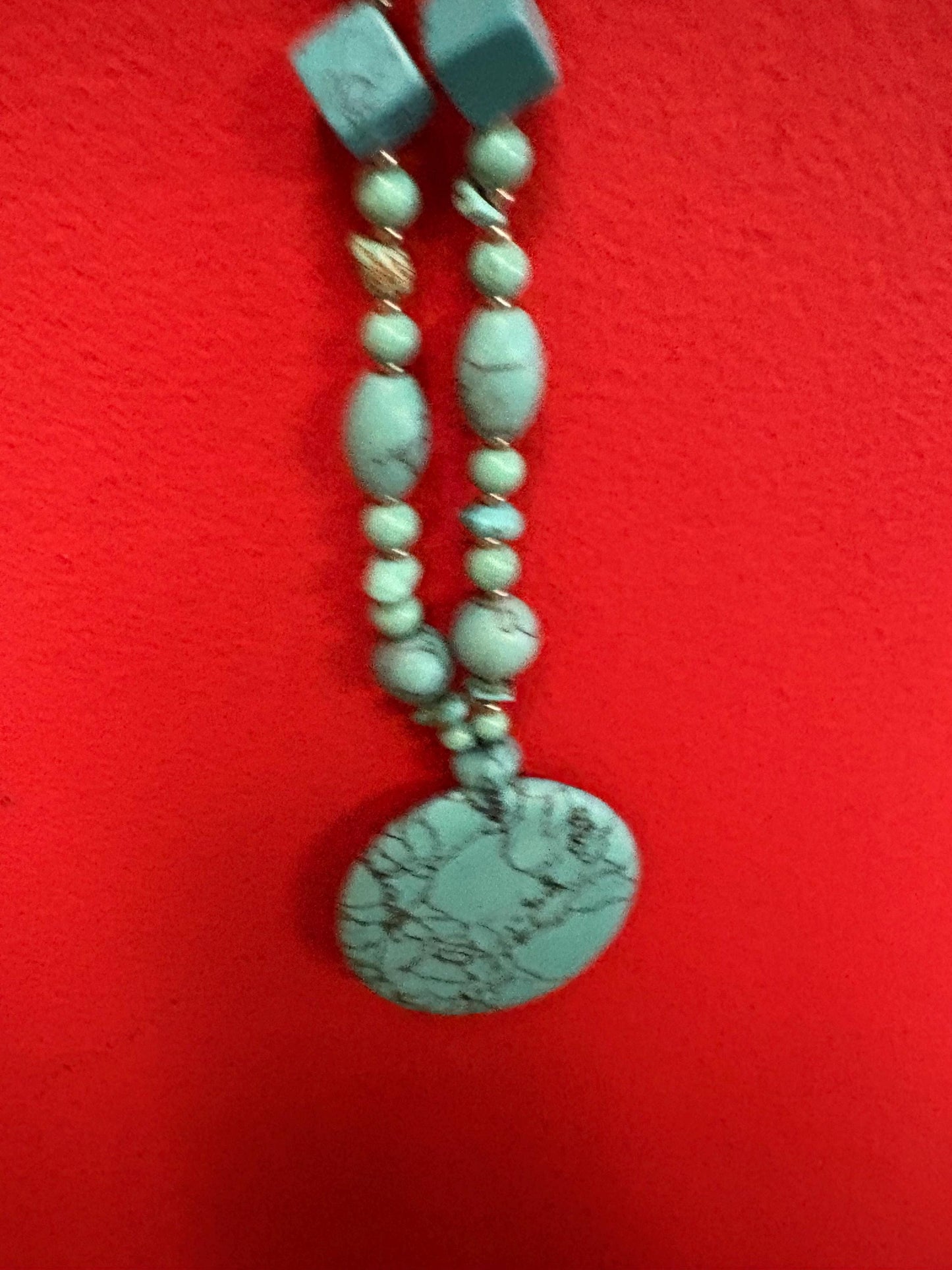 Beautiful turquoise necklace approximately 26 inches long with a 3 inch pendant great value