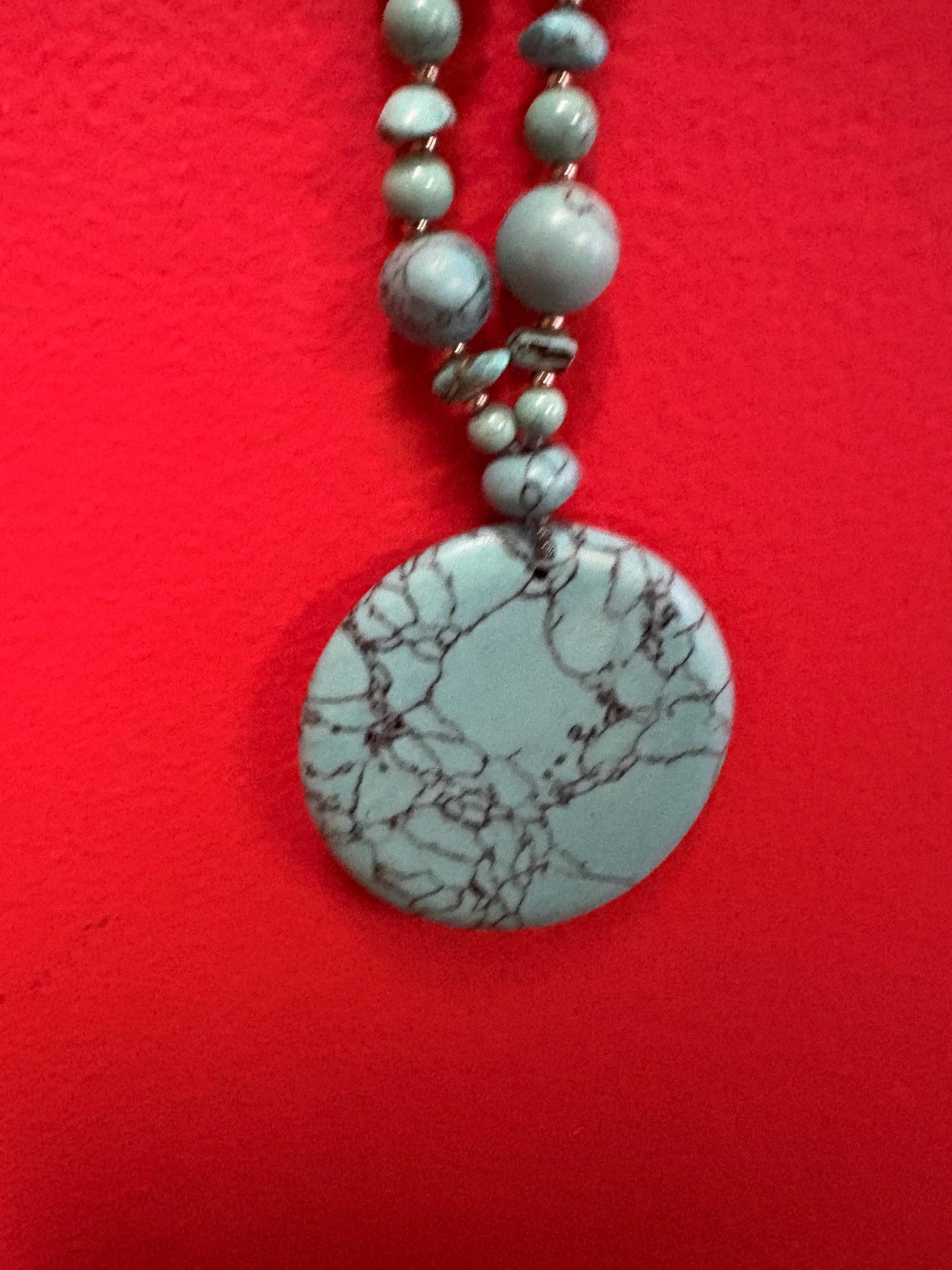 Beautiful turquoise necklace approximately 26 inches long with a 3 inch pendant great value