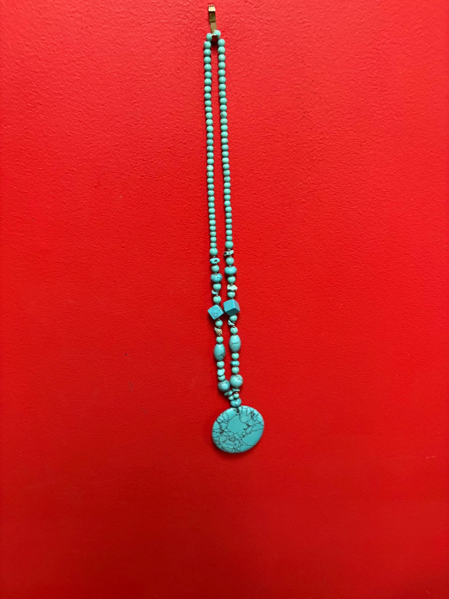 Beautiful turquoise necklace approximately 26 inches long with a 3 inch pendant great value