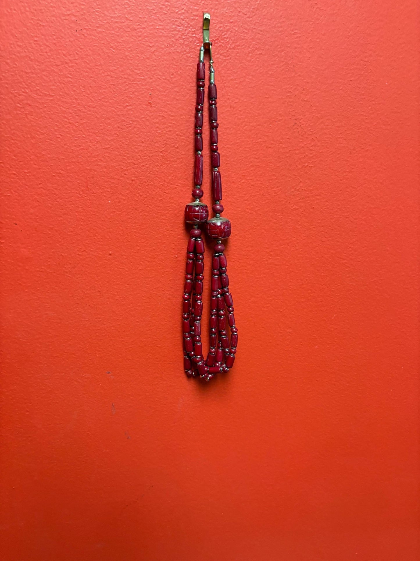 Approximately 22 inch long carved stone and metal necklace very unusual and great value