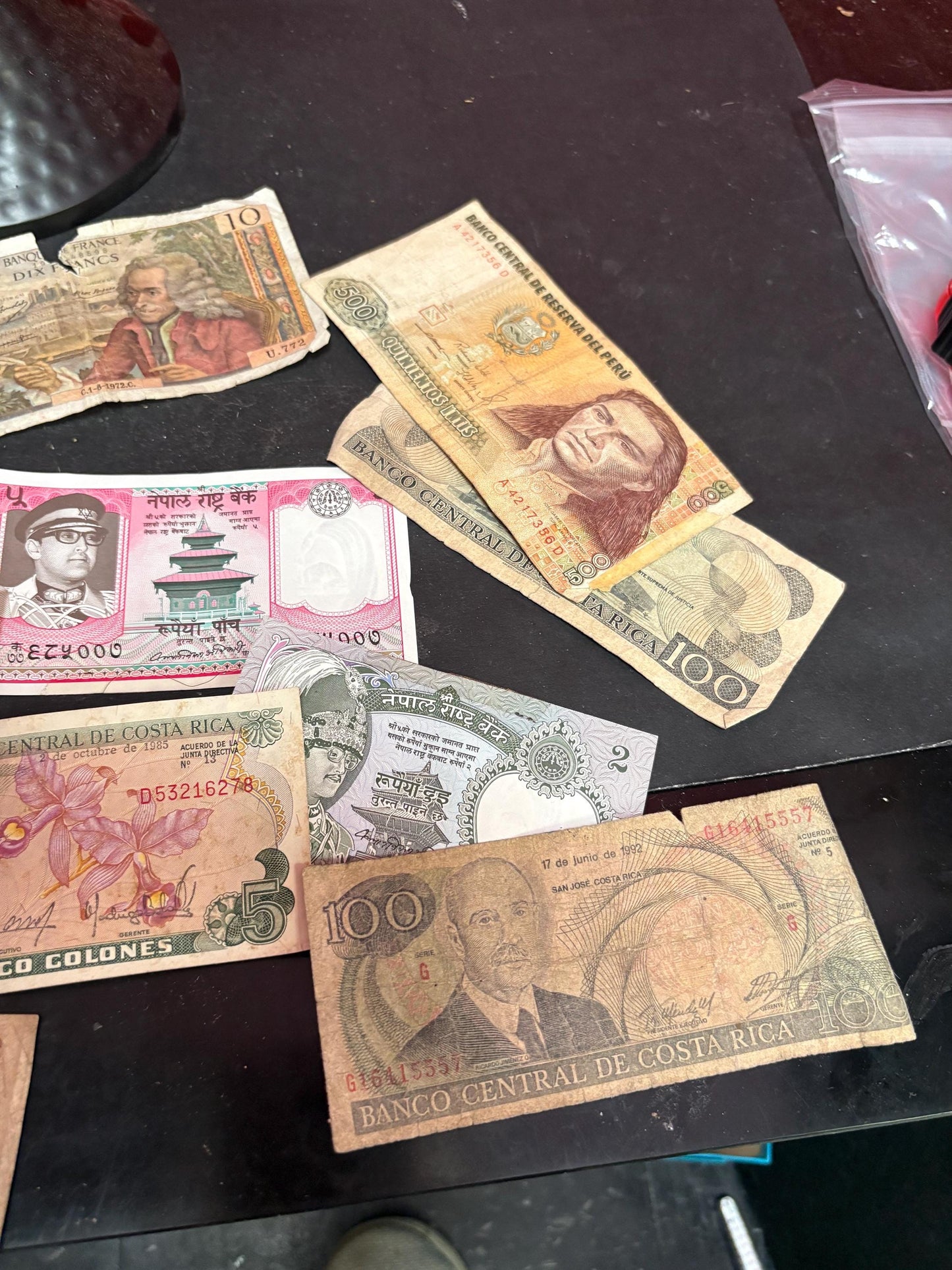 Pile of vintage international bank notes   get rich quick
