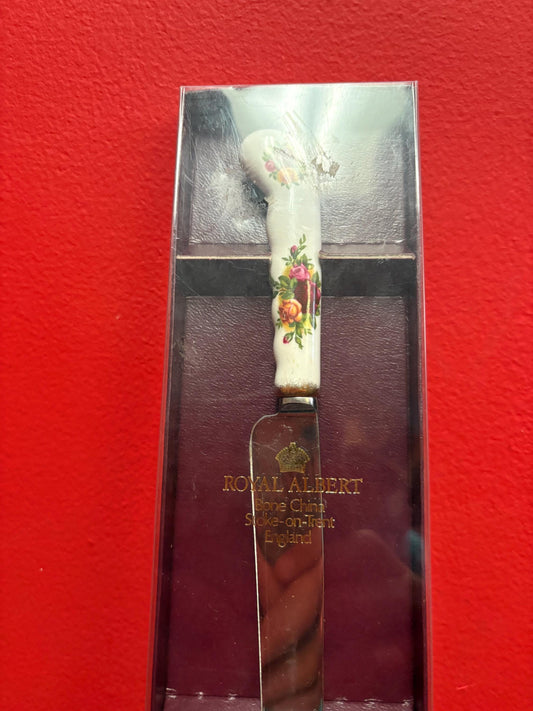 Royal Albert old country Rose 9 1/2 inch long bread knife in original box  brand new condition- wow