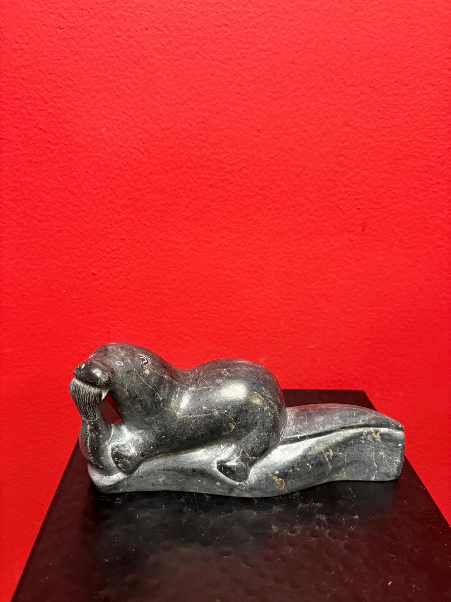 Beautiful old soapstone seal on log with fish in Mouth   7 inches long signed in good condition indigenous Inuit