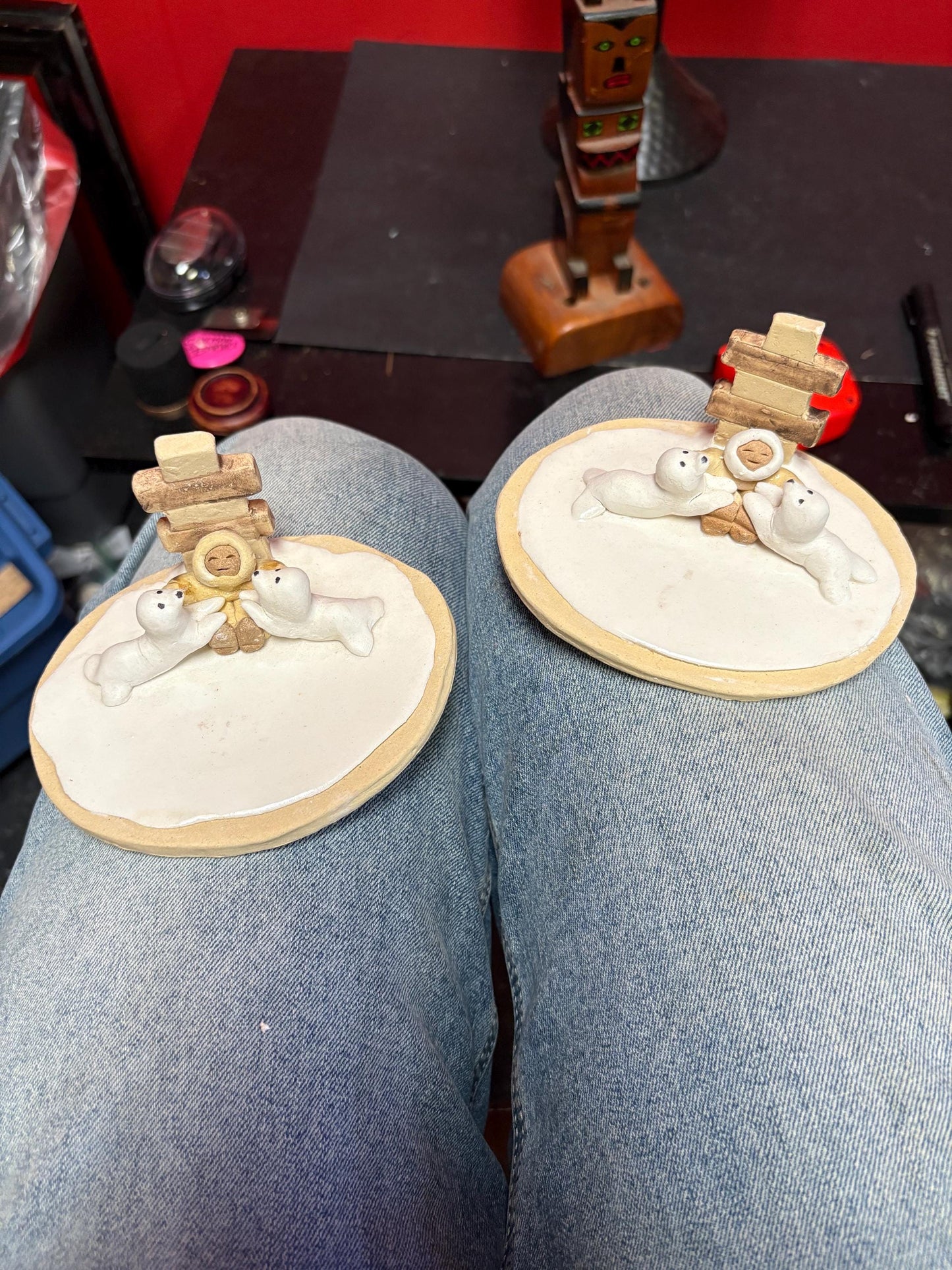 Beautiful indigenous statue of an Eskimo and seals and an Inukshuk  5 x 2 1/2“ high signed  2 available