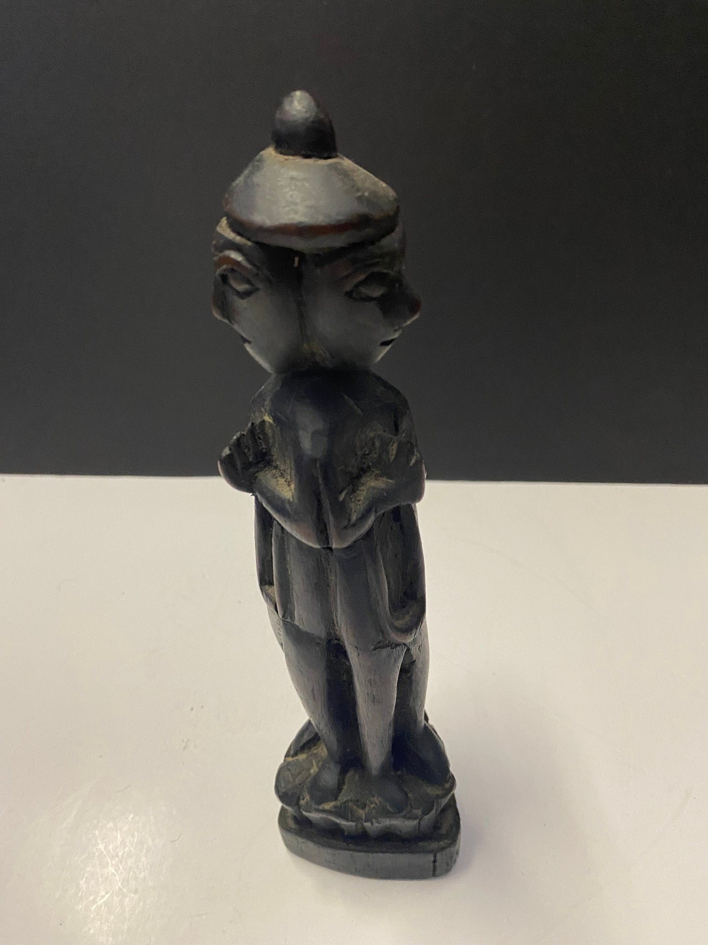 South East Asian carved 3 sided figure praying