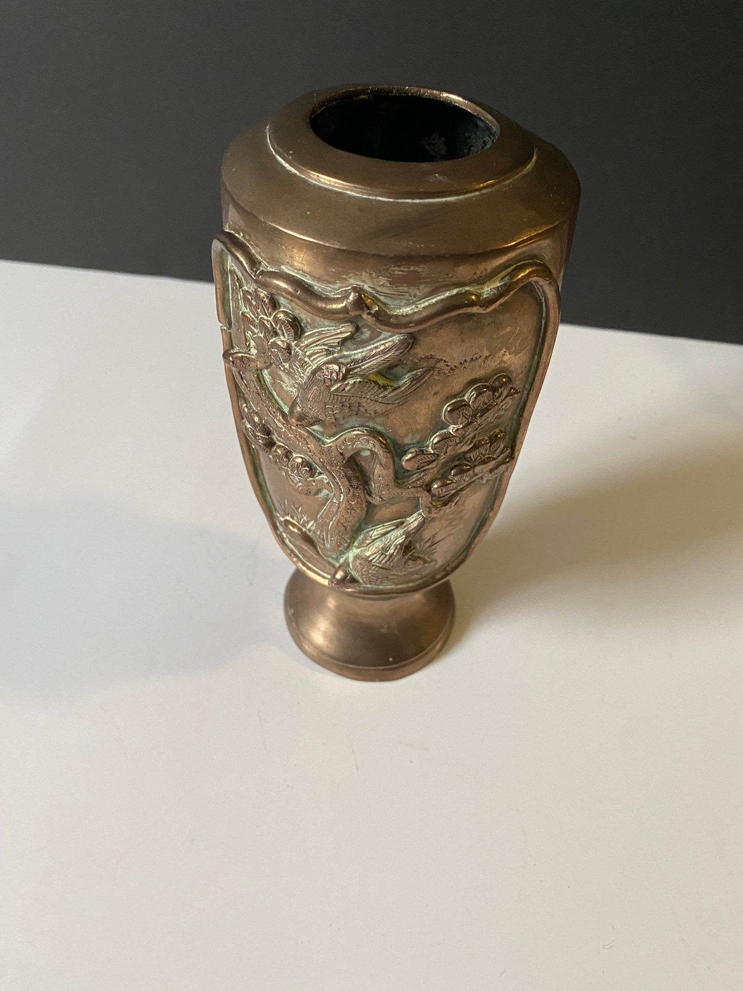 A  9 inch heavy bronze Chinese vase depicting birds on branches  Approximately 500 g  stunning patina