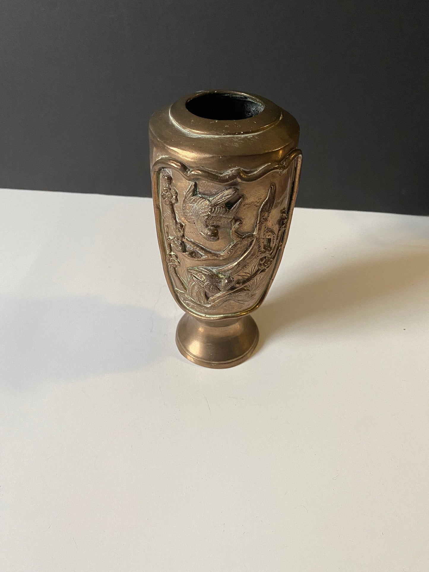 A  9 inch heavy bronze Chinese vase depicting birds on branches  Approximately 500 g  stunning patina