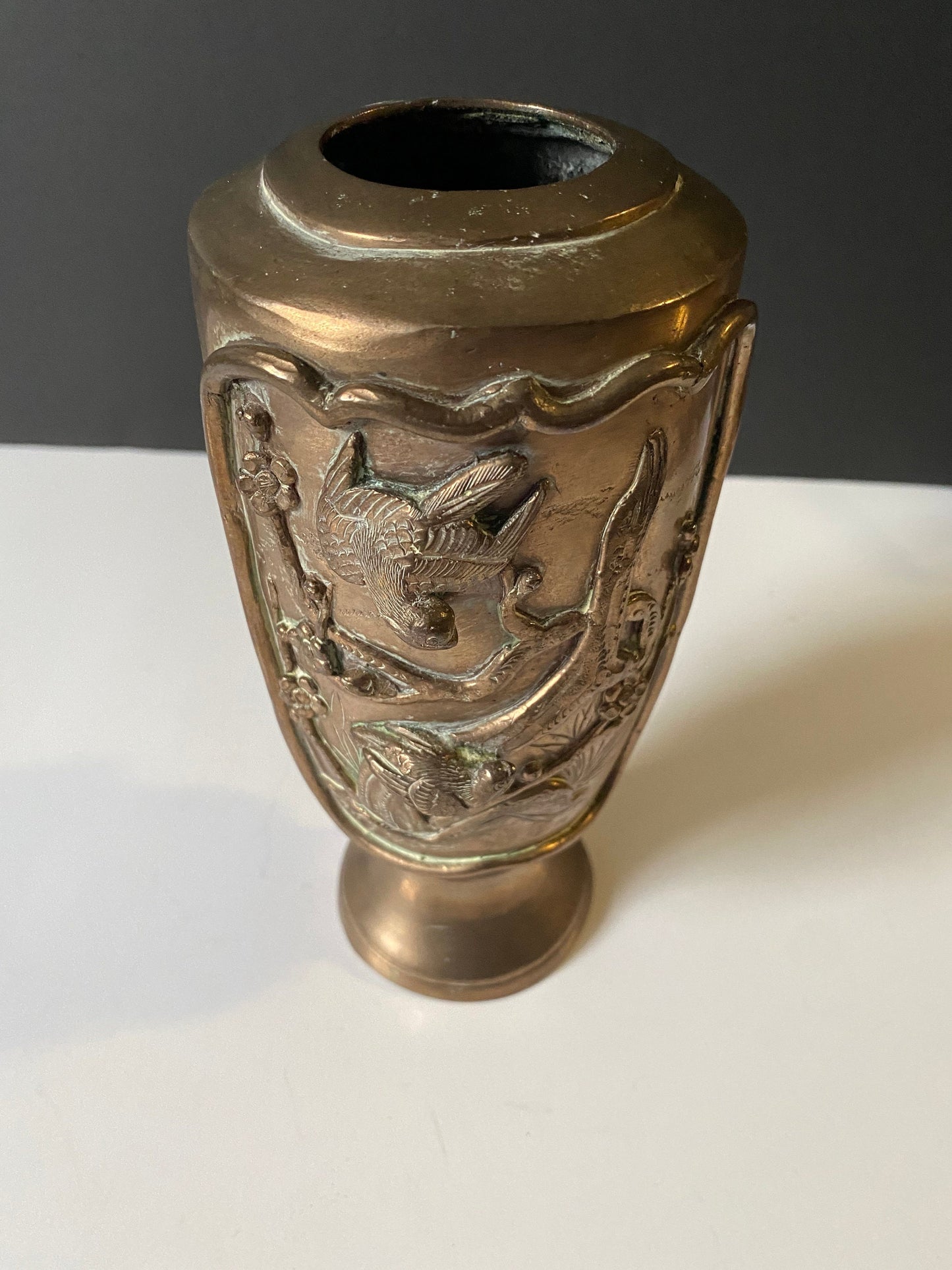 A  9 inch heavy bronze Chinese vase depicting birds on branches  Approximately 500 g  stunning patina