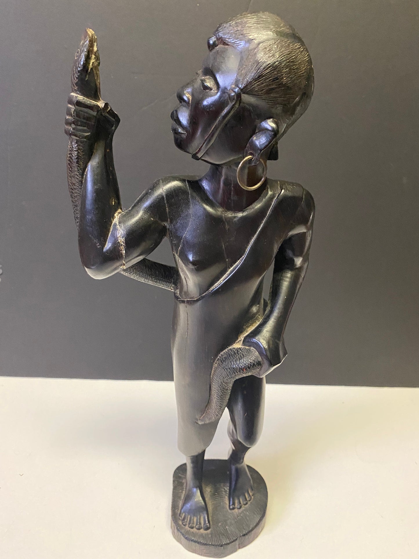 Absolutely spectacular 16 inch tall western African ebony statue of a snake charmer