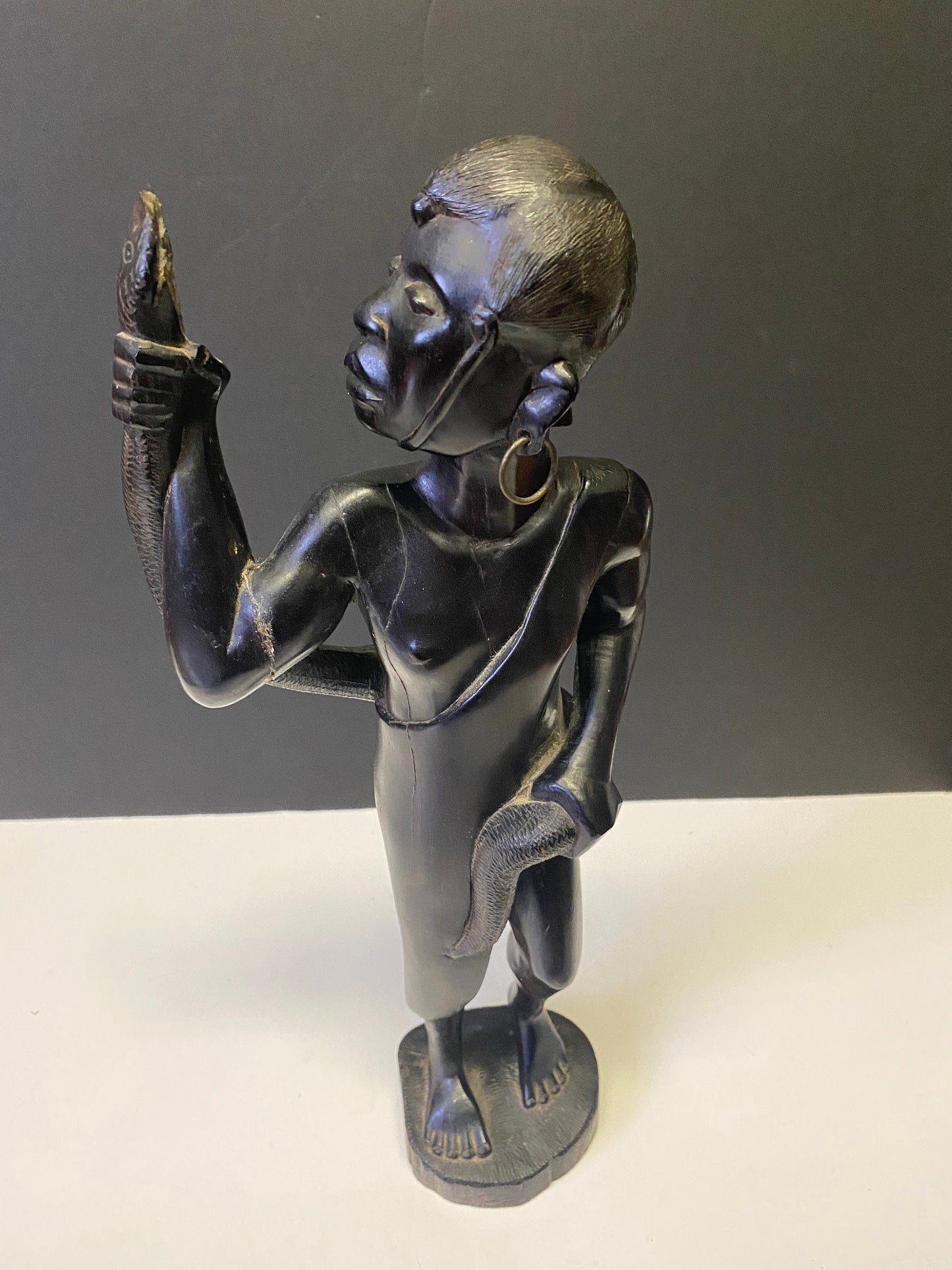 Absolutely spectacular 16 inch tall western African ebony statue of a snake charmer