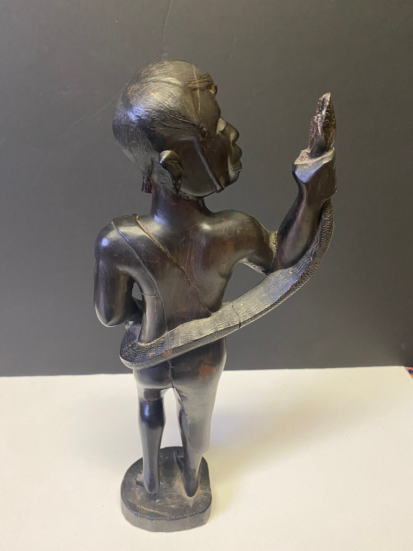 Absolutely spectacular 16 inch tall western African ebony statue of a snake charmer