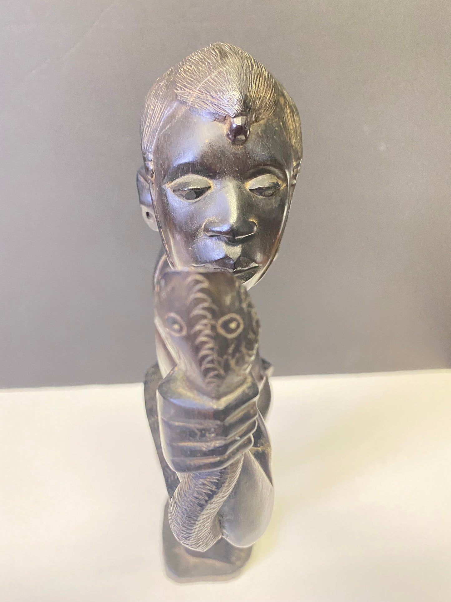 Absolutely spectacular 16 inch tall western African ebony statue of a snake charmer