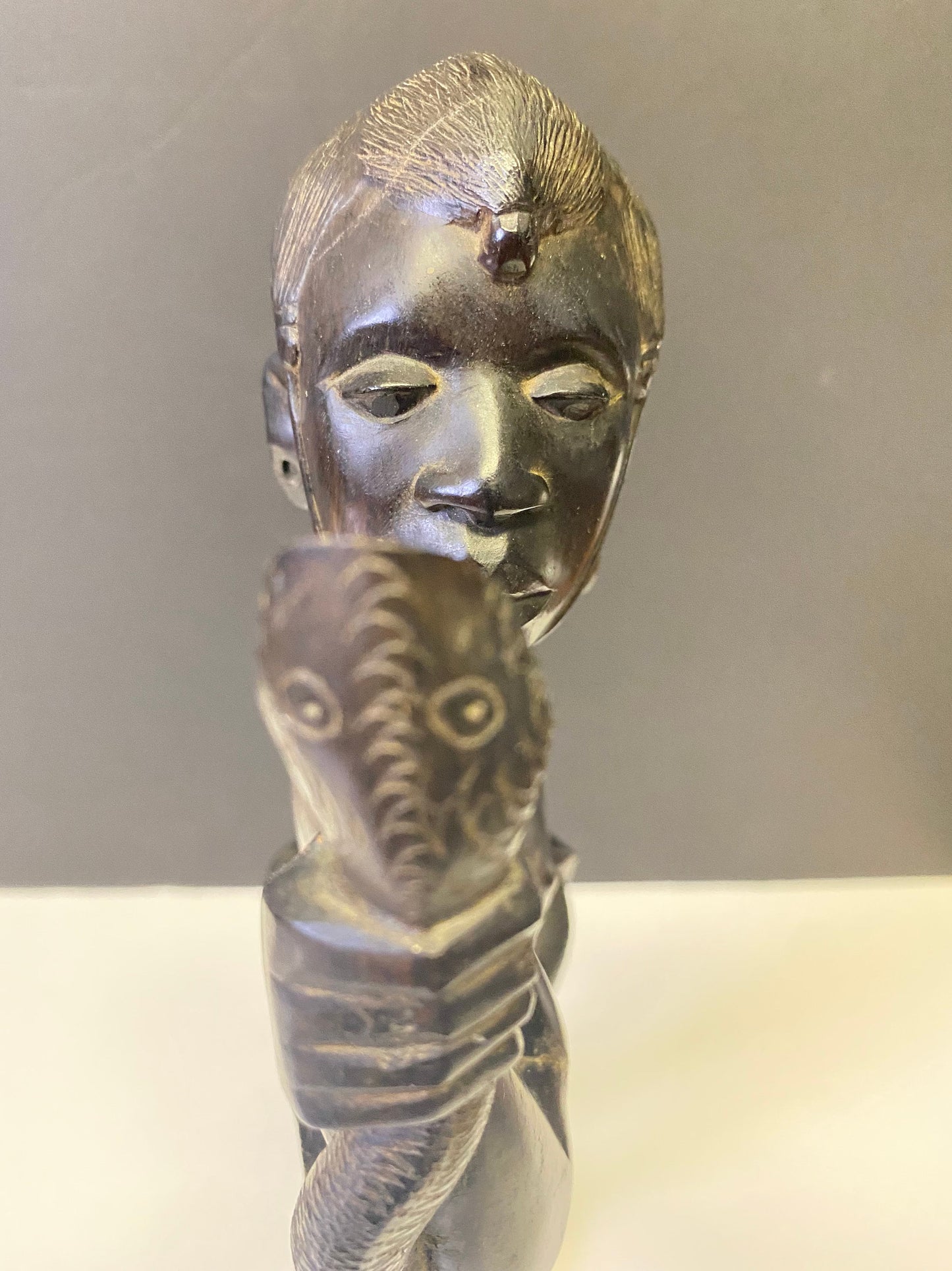 Absolutely spectacular 16 inch tall western African ebony statue of a snake charmer